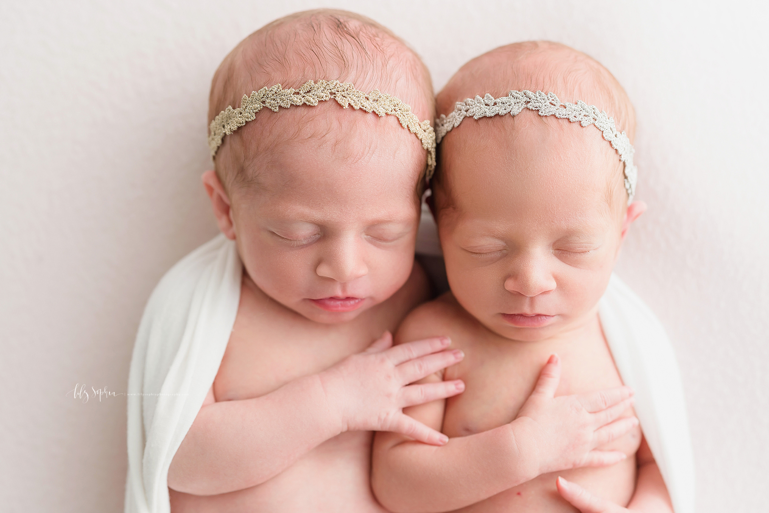  Newborn photo of fraternal twins as the brother places his hand on his sister’s shoulder taken in Atlanta in a natural light studio. 