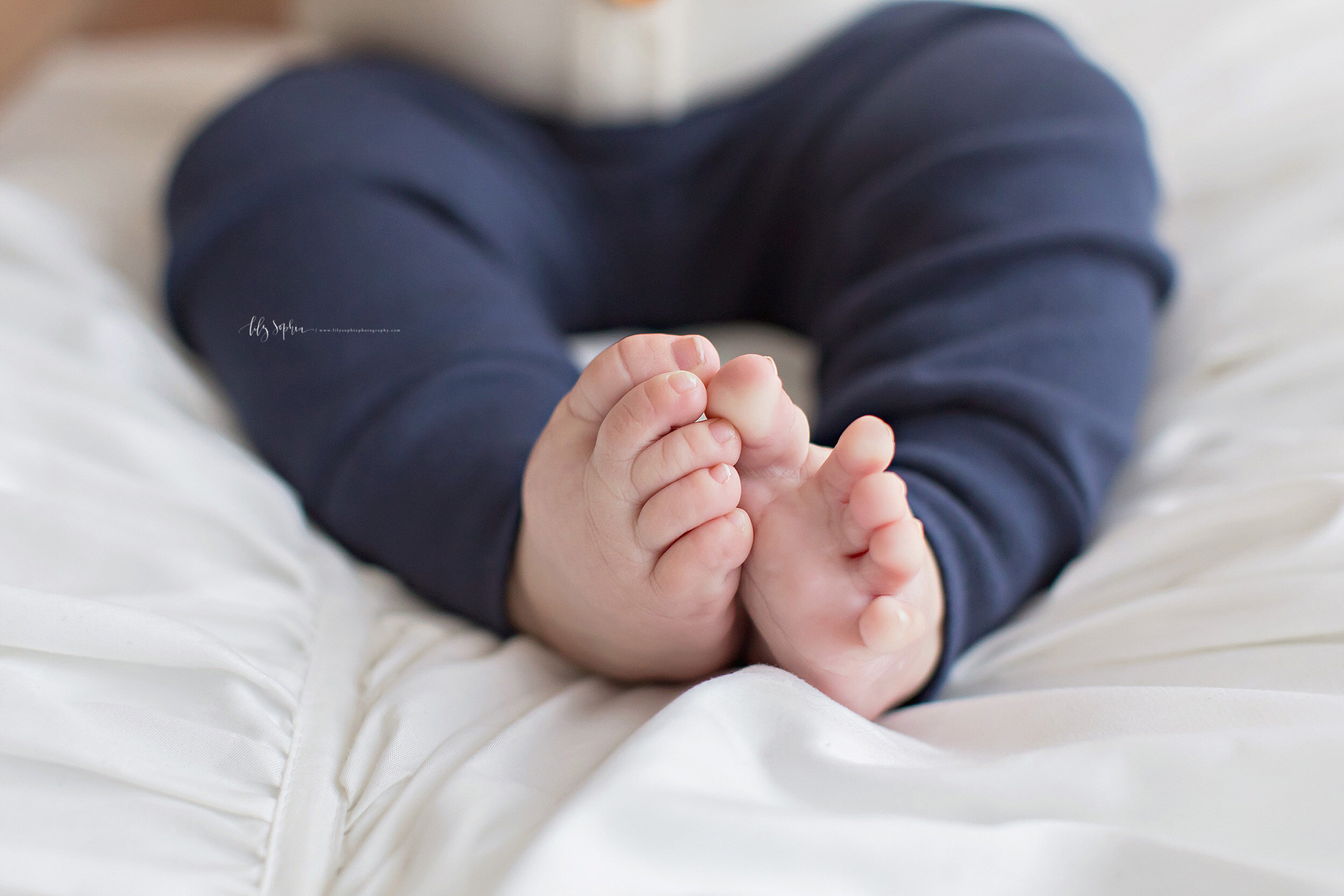  Photo of the cute toes of a five month old little boy taken in natural light in an Ansley Park studio in Atlanta, Georgia. 