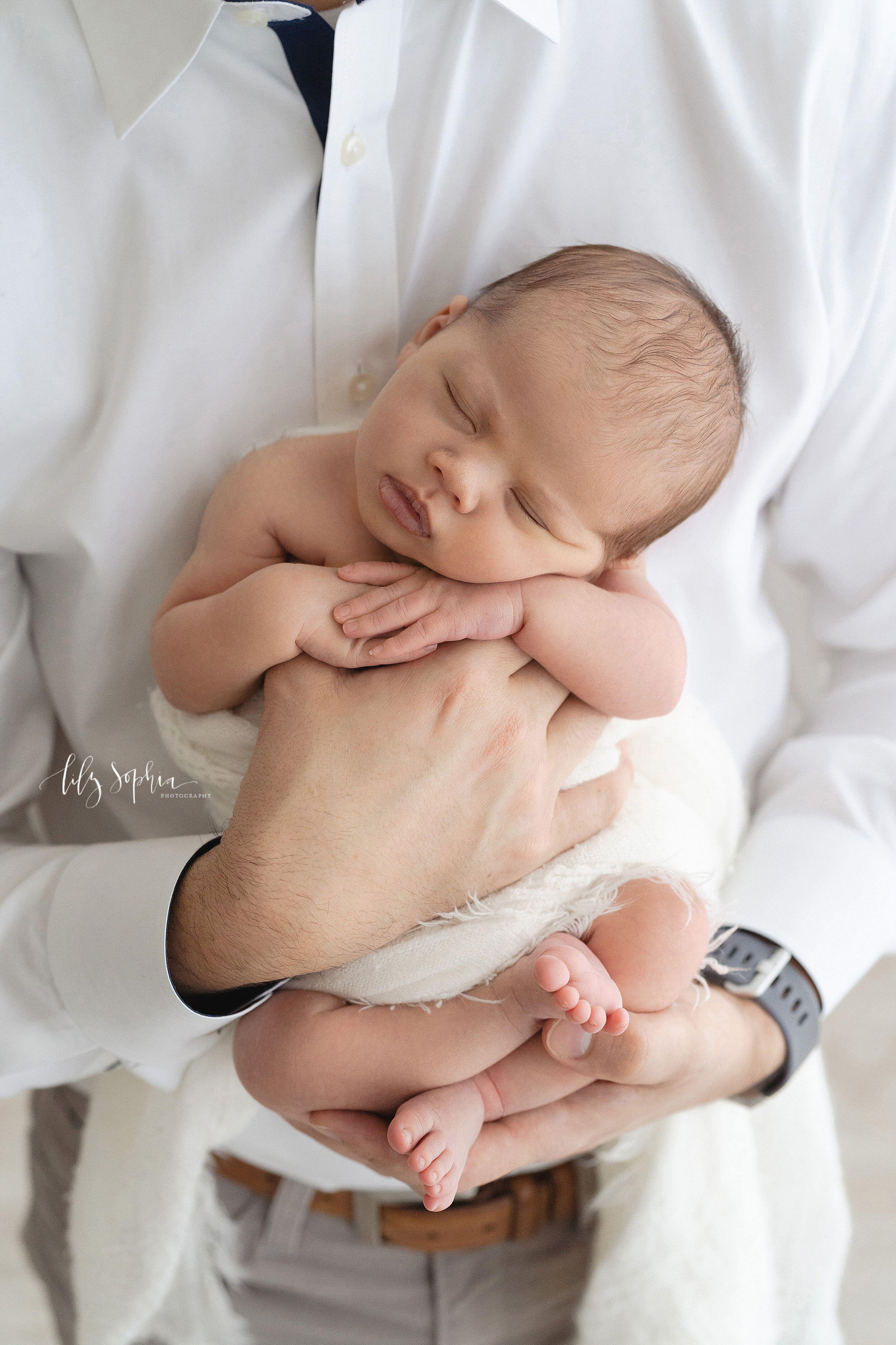 Newborn baby boy waiting for being dressed after birth Stock Photo
