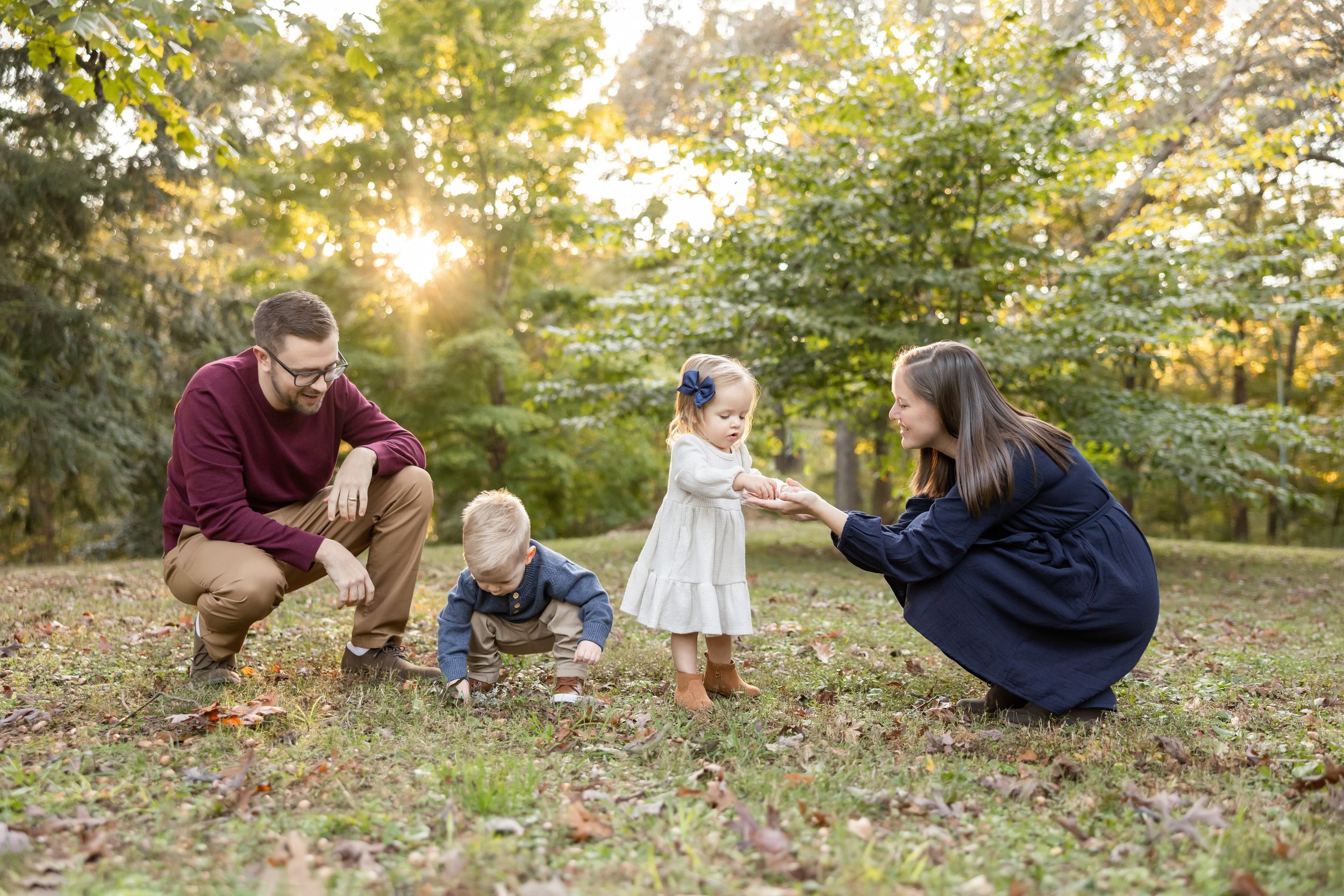  Family photo session with a father, mother, a daughter and a son taken at sunset in a park near Atlanta. 