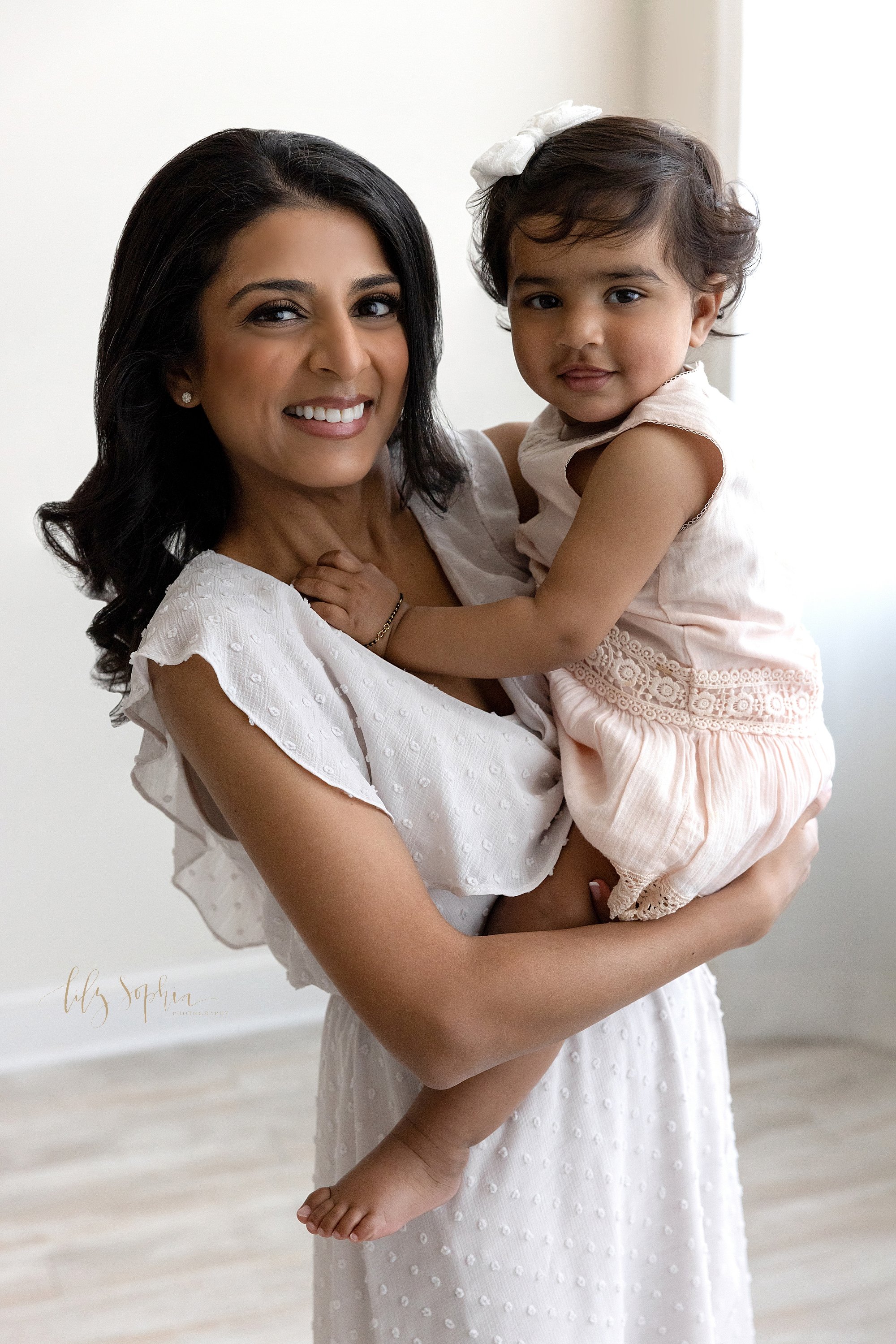  A mother celebrates her daughter’s first birthday with a photo shoot in a natural light studio near Buckhead in Atlanta, Georgia. 