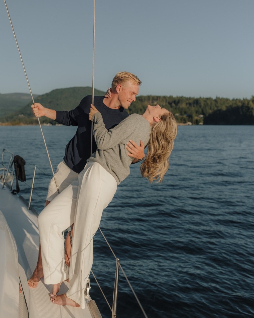 Sailing into golden hour with Emily and Cam felt like a dream. 
Emily reached out wanting couples photos on her family&rsquo;s sailboat, and closer to the shoot date, her partner Cam messaged us to say he&rsquo;d be proposing during the shoot. She ha