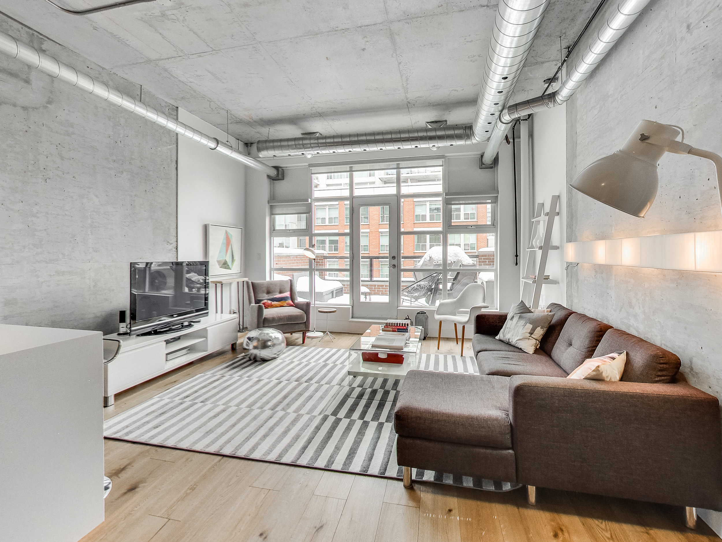High ceilings, floor to ceiling windows there's so much natural light in this unit! 