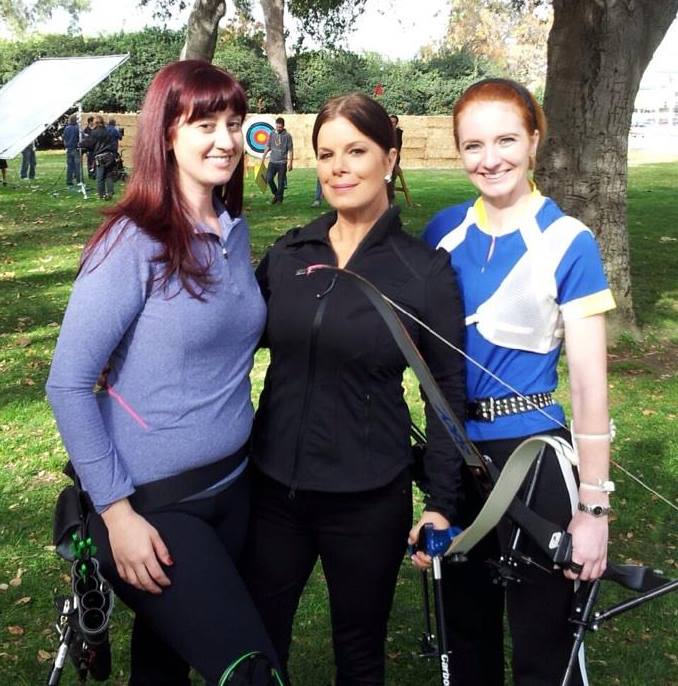 One of our archery coaches (right) and on-call archers (left) working on set