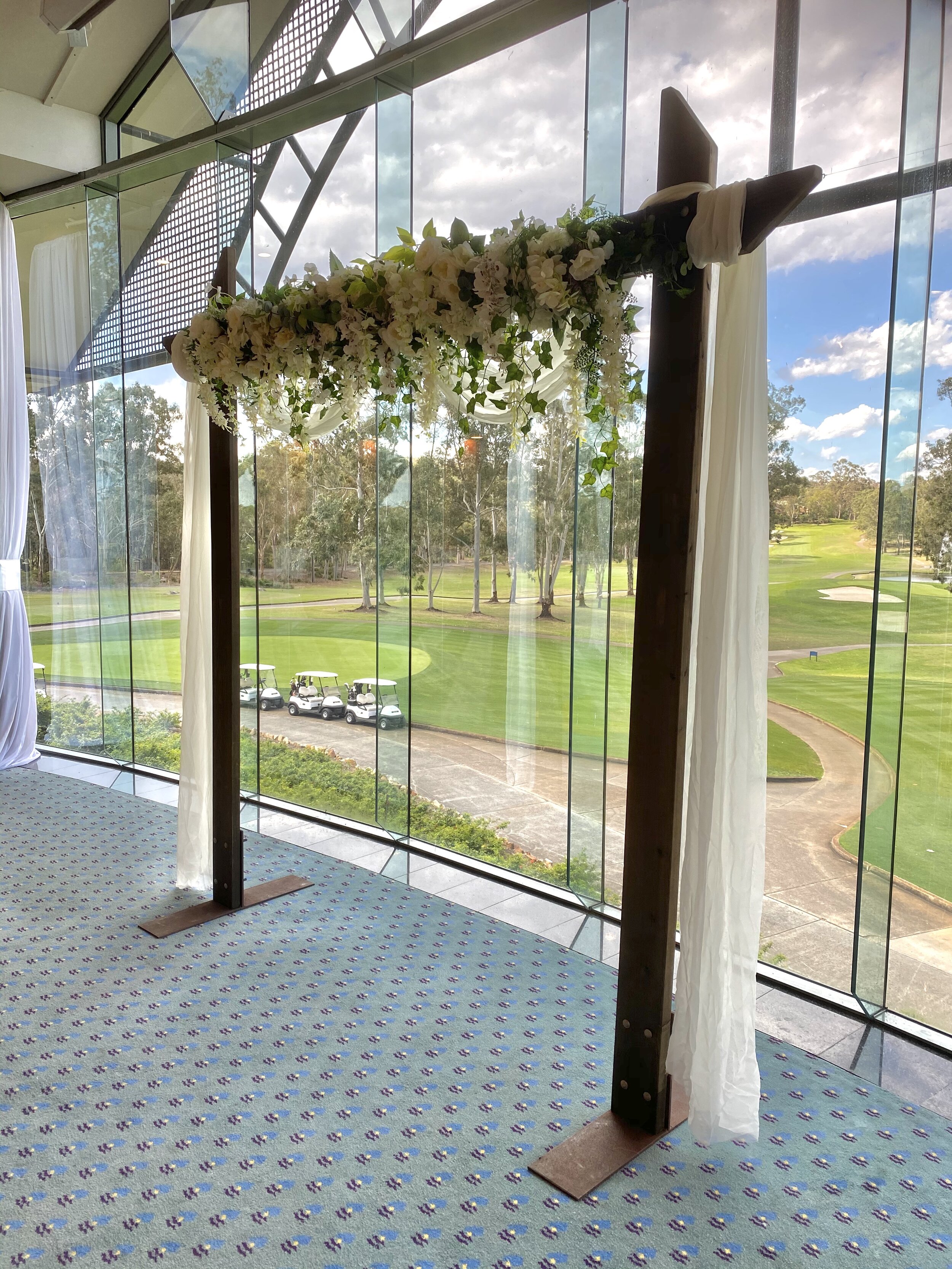 wooden arch with flowers and draping2.jpg