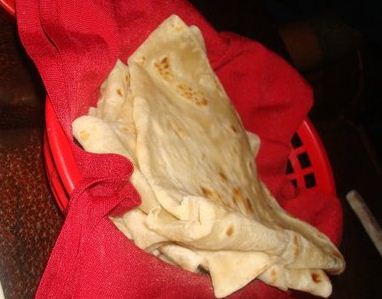 A basket of freshly made flour tortillas served alongside our meal at Paco's Tacos in Los Angeles.