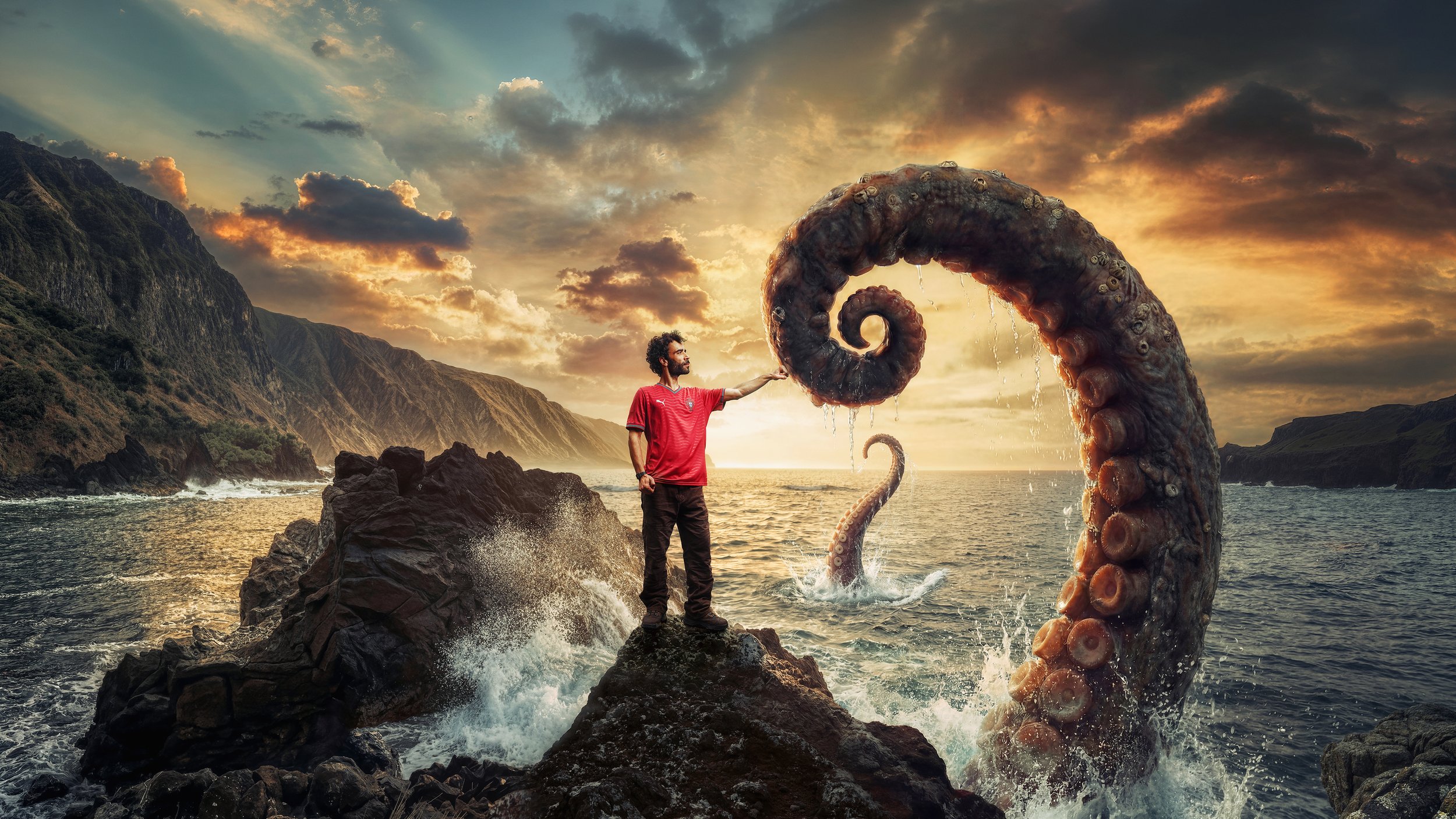BETCLIC é uma Sorte apoiar Portugal — fan in red Portugal shirt facing a giant octopus tentacle on the coast at sunset