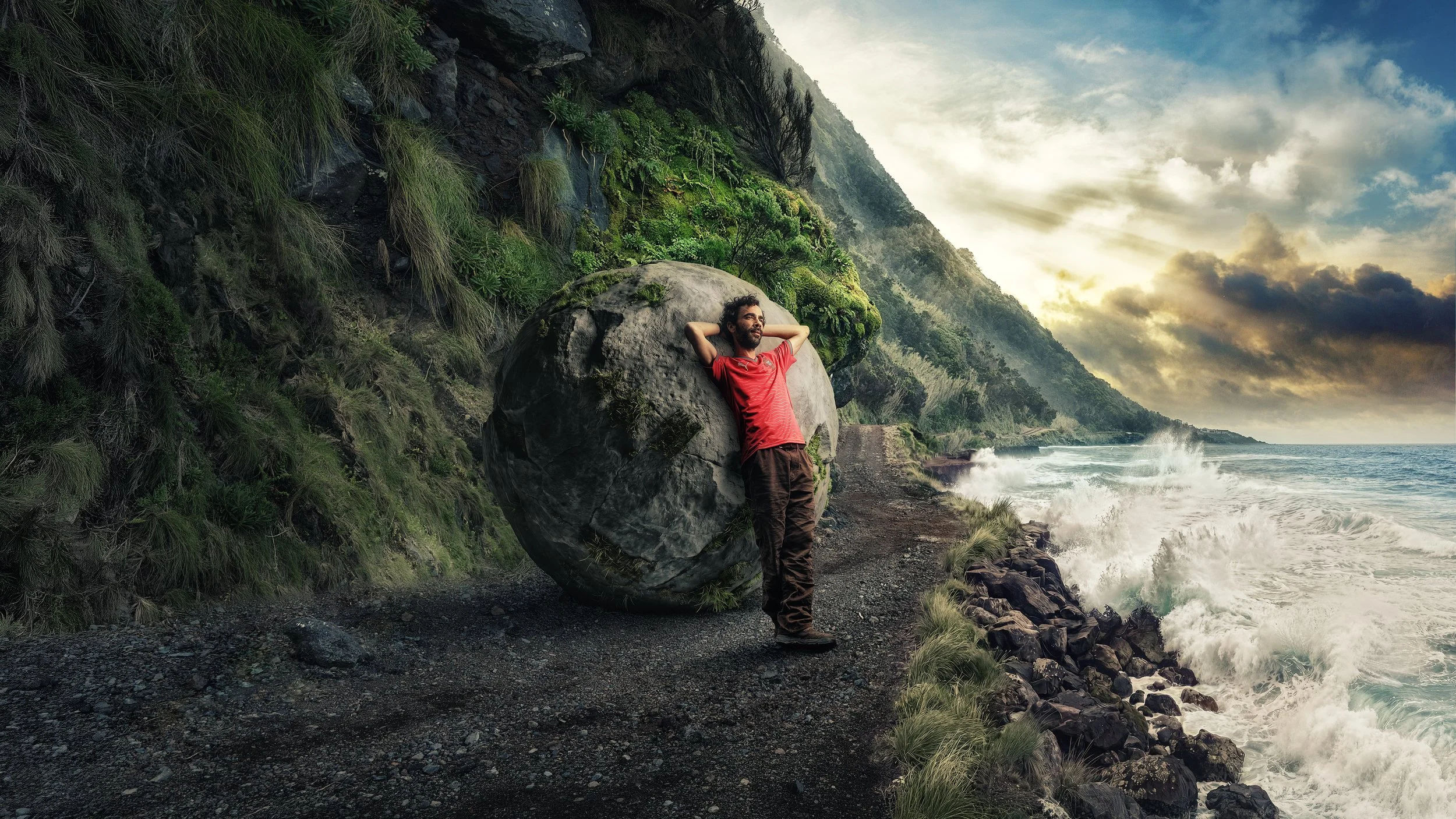 BETCLIC é uma Sorte apoiar Portugal — fan in red Portugal shirt on a rugged cliffside coastal path by the ocean