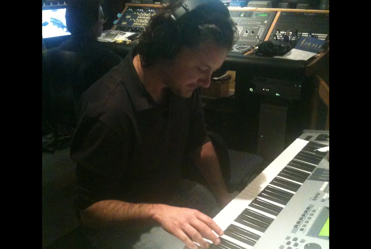 Marc Lawson playing keys on his second album