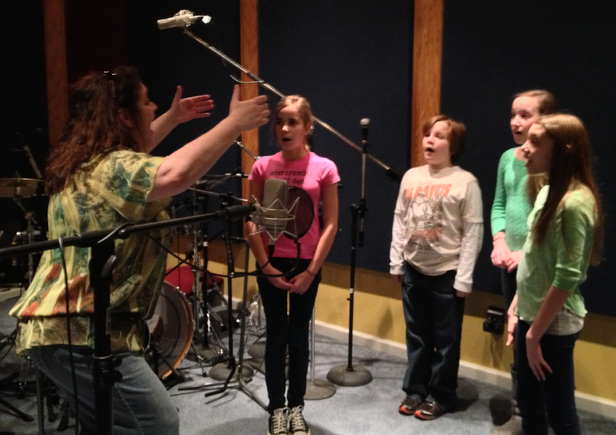 Traci Davison coaching small girls choir