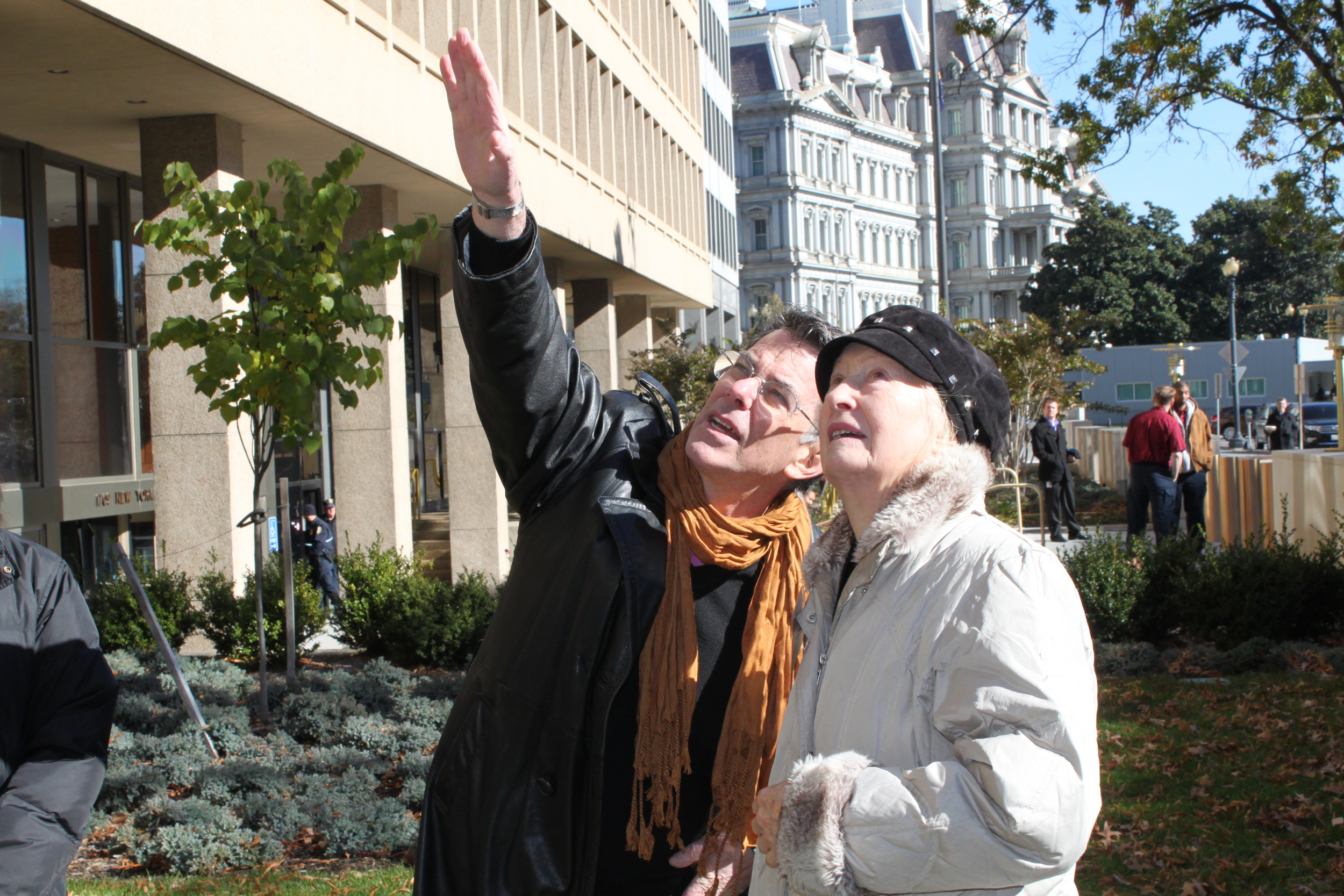  International Arts &amp; Artists President David Furchgott and Artist Emilie Brzezinski observe Arch in Flight's placement in front of the Federal Reserve Building. 