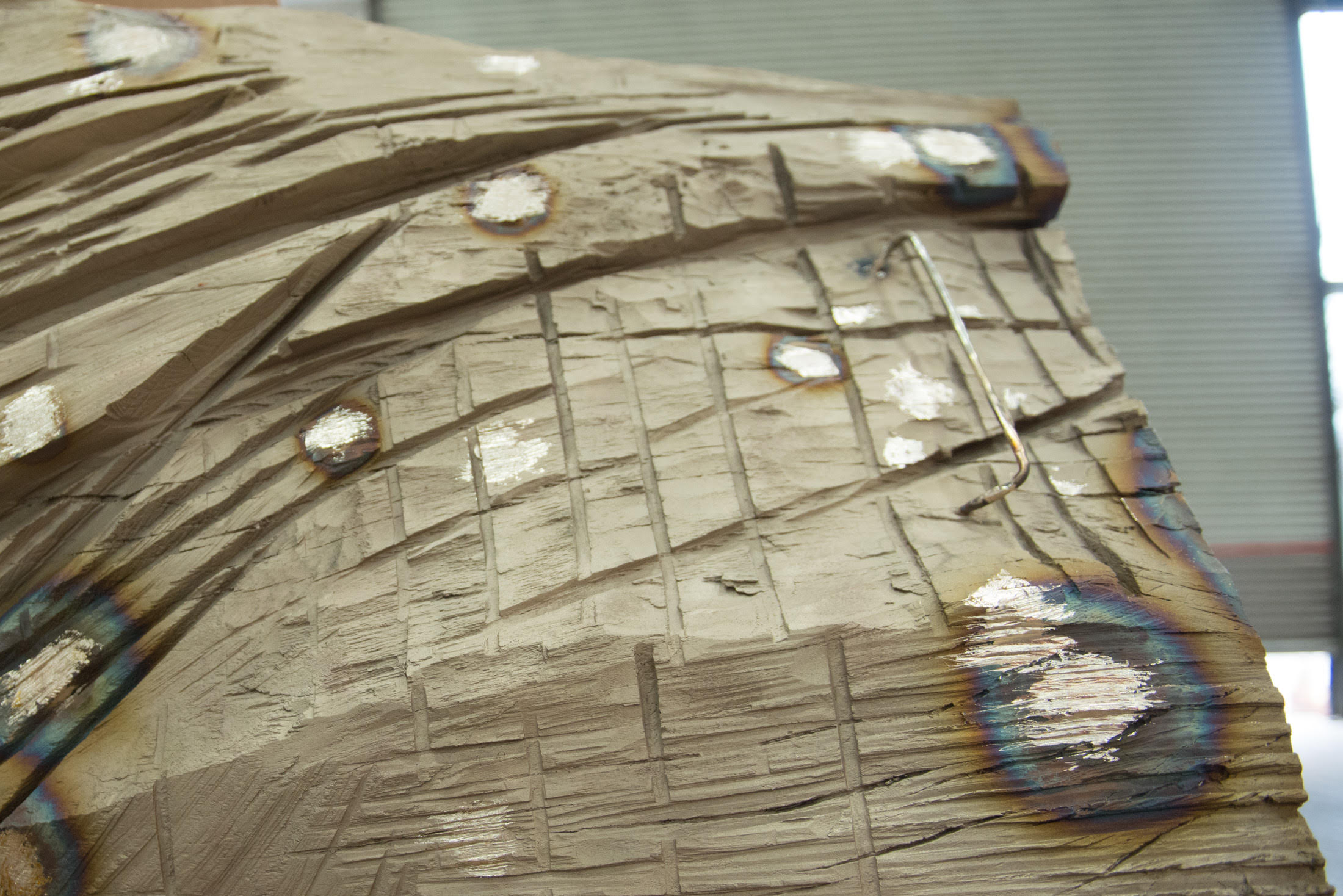 Here, the cast is shown without application of patina. 