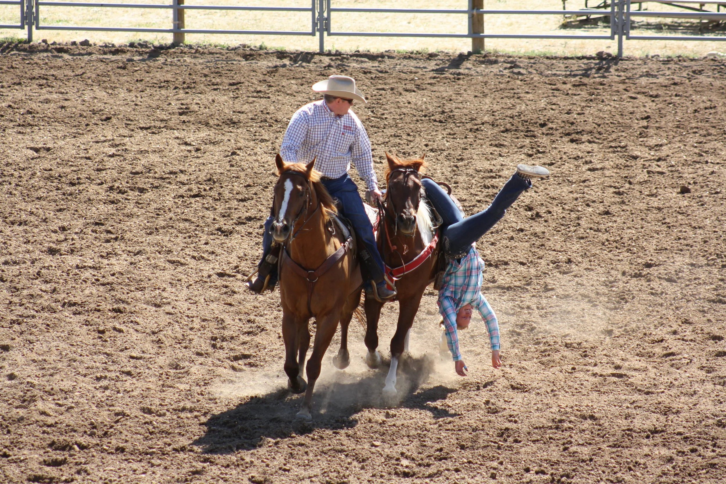 One of the Flat Tops RBC trick riding students doing a Cossack Drag on the rodeo on the last day of the camp. I'm very thankful for good horses that I can trust.