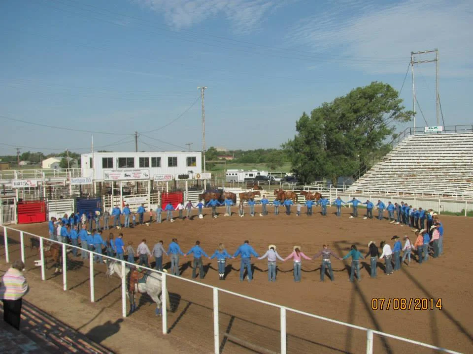 Here's a great picture of the "Prayer Circle" right before the rodeo performance on the last day of the Texas Rodeo Bible Camp. 