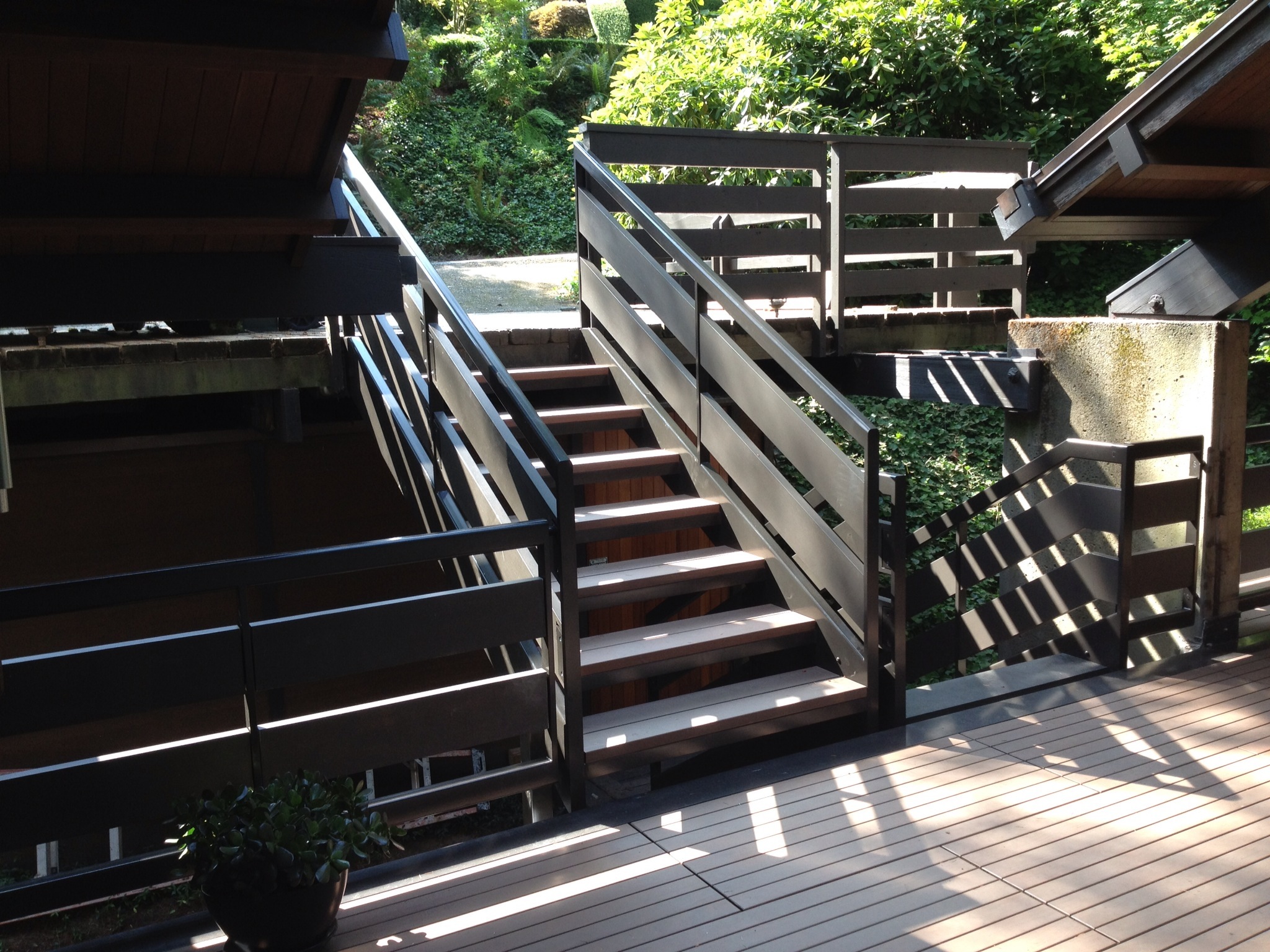  Staircase and railing out of painted steel. Railing continued around the entire deck with wood infill.&nbsp;  Designed by Paul McKean Architects 