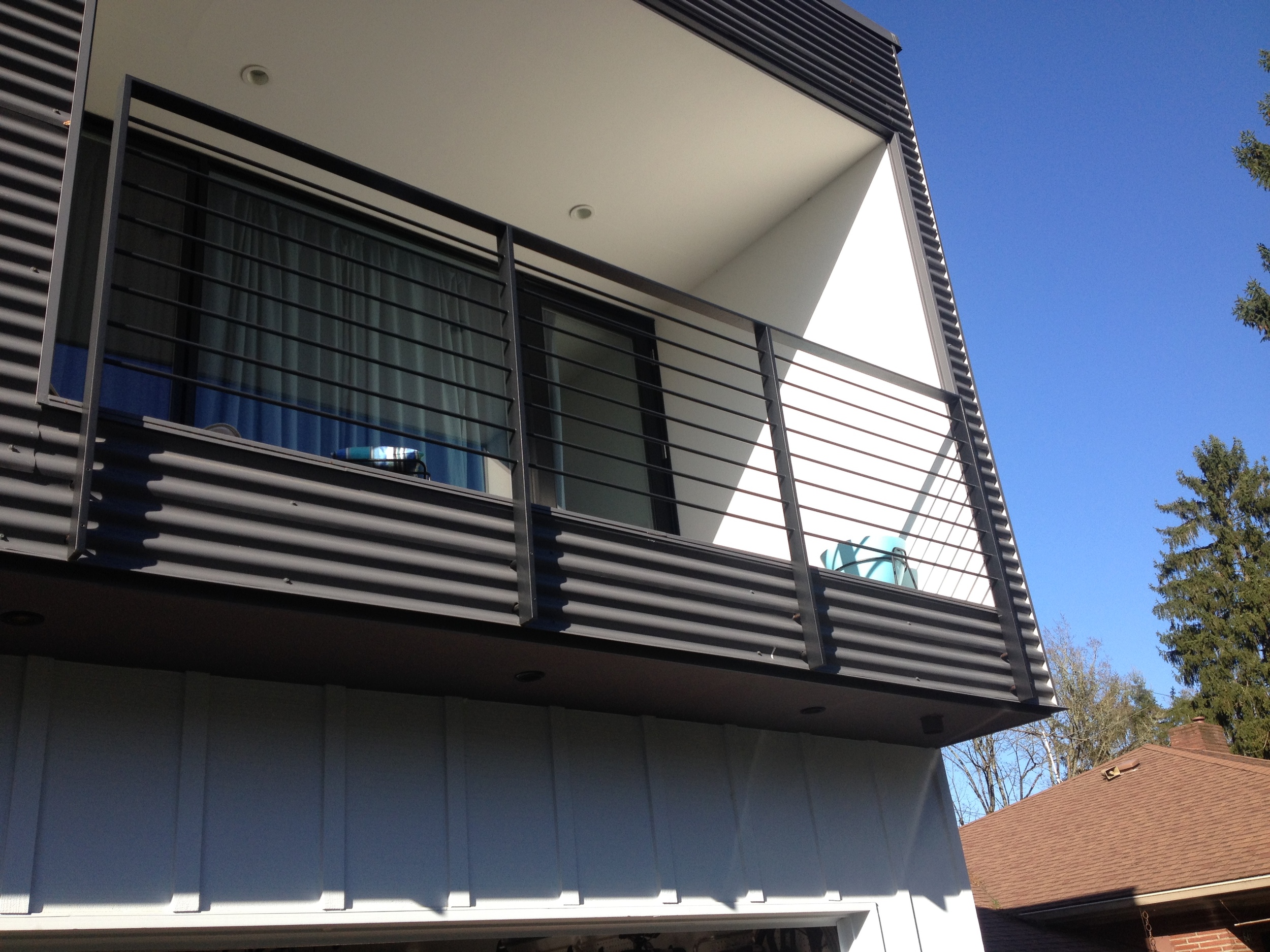  Painted steel railing with round rod infill  Designed by Paul McKean Architecure 