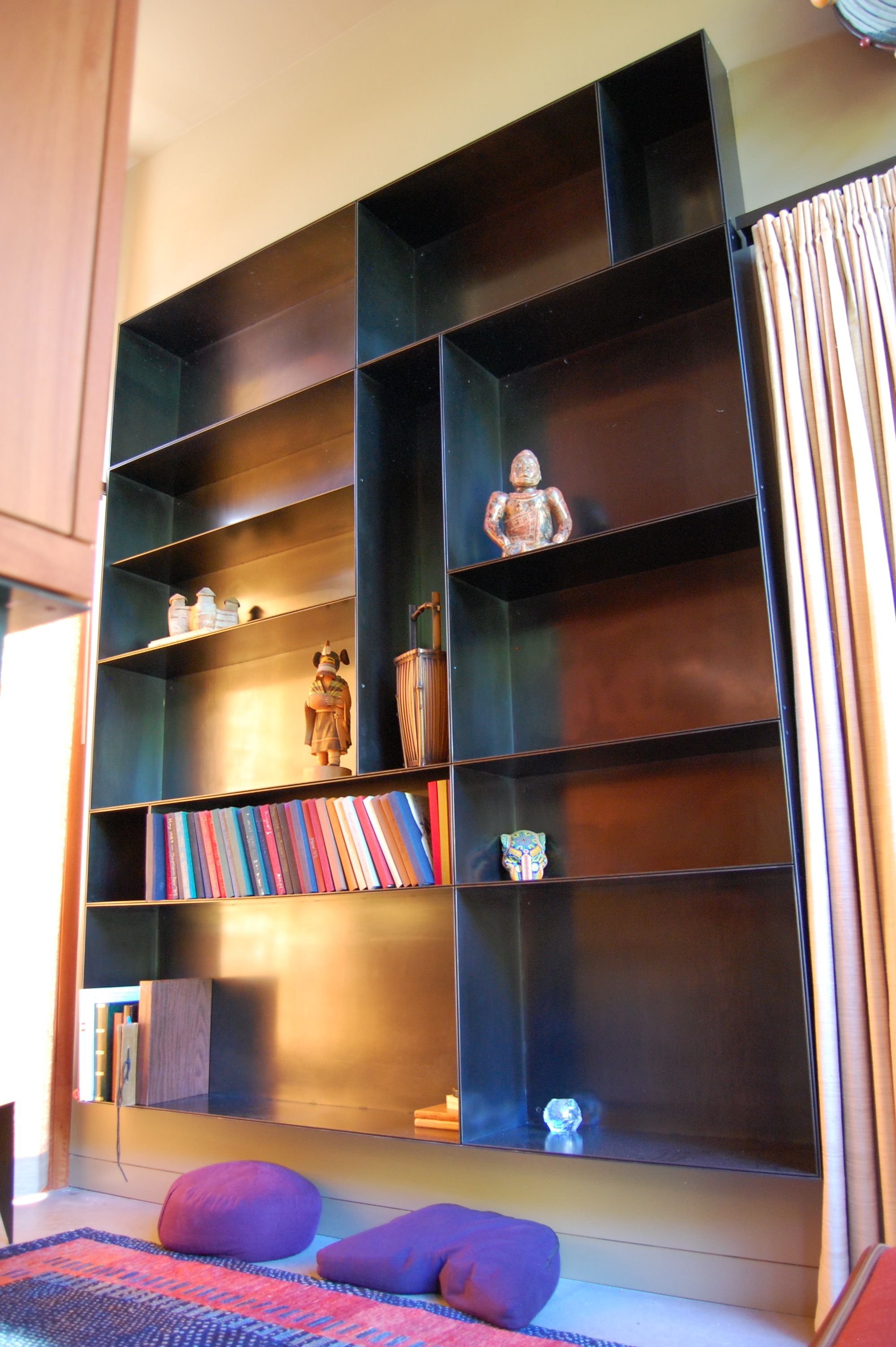  Built in book shelves. Each shelf is an individual hot rolled steel box.  Designed by Eggleston/Farkas Architects 