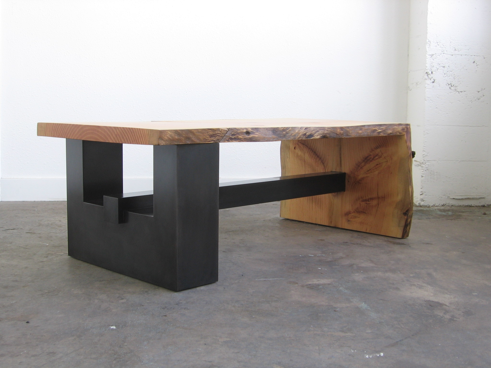  Blackened Steel Base with a live edge top that was taken from the residence property.  Designed by Formed Objects 