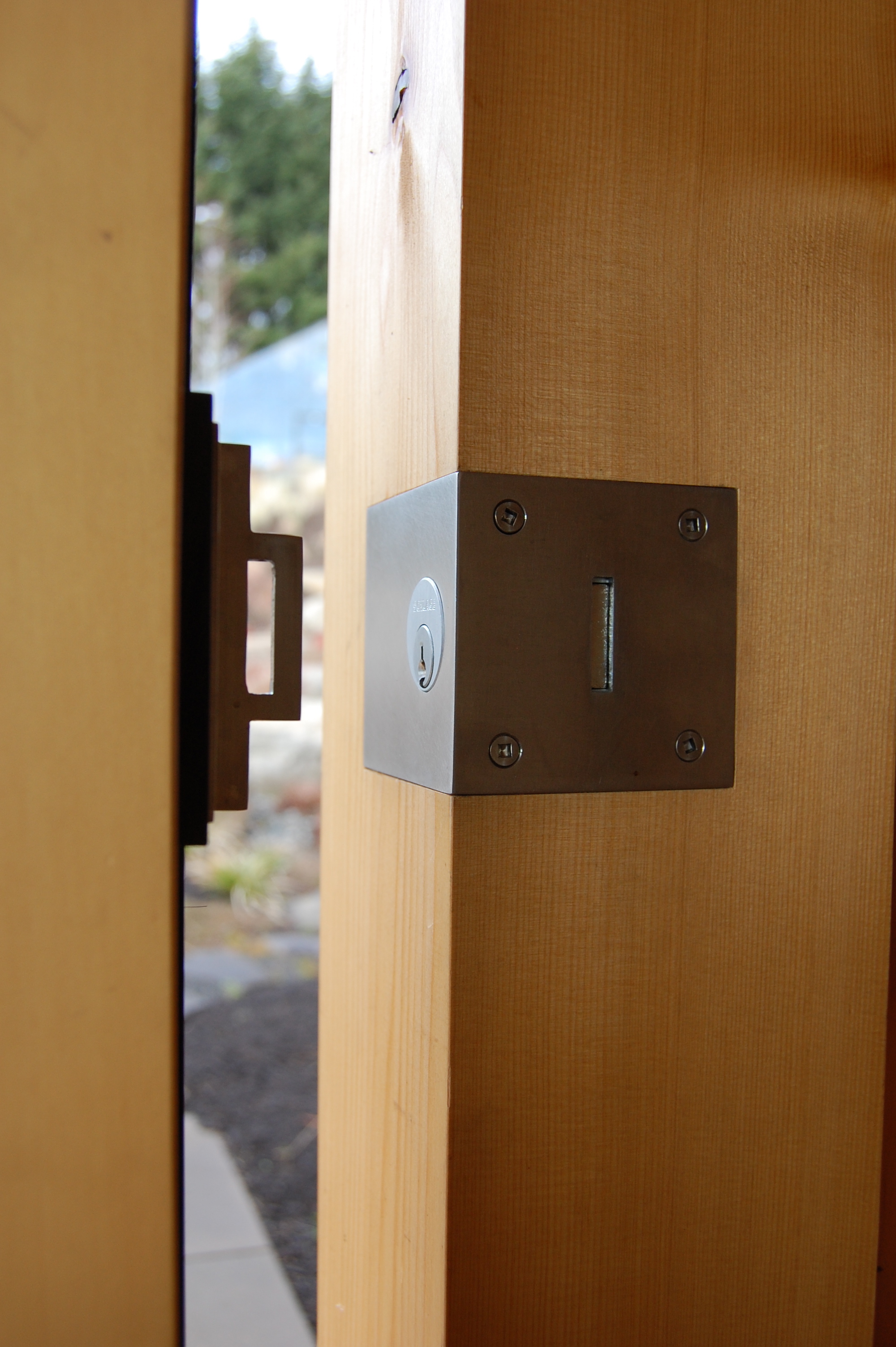 Stainless steel door lock.  Designed by Greenline Fine Woodworking 
