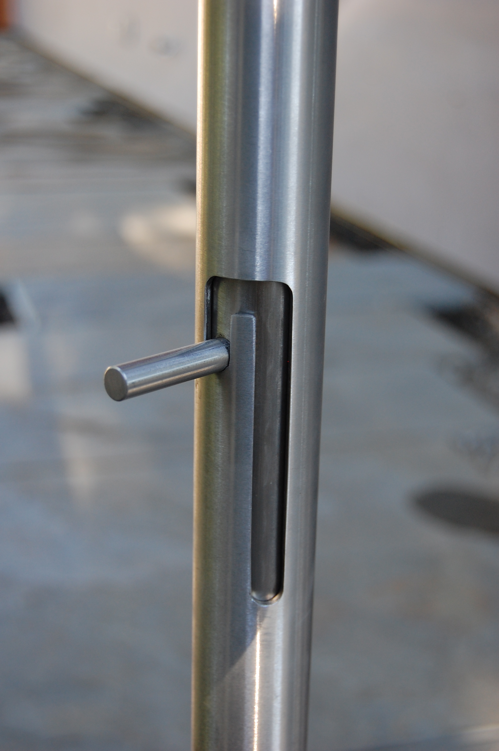  Integrated cane bolt housed in a door handle for a gate. All Stainless steel  Designed by Formed Objects 