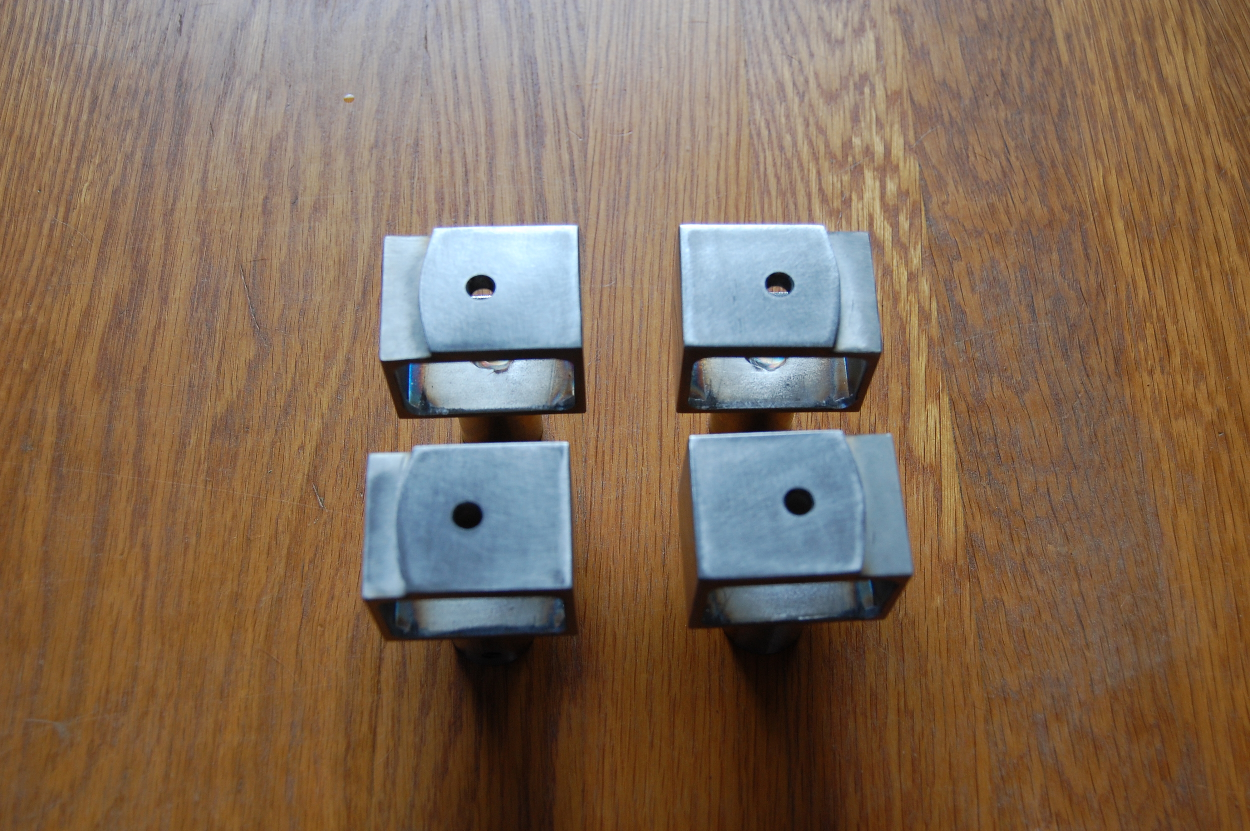 Stainless steel door handle standoffs.  Designed by Group Jake Collaborative 