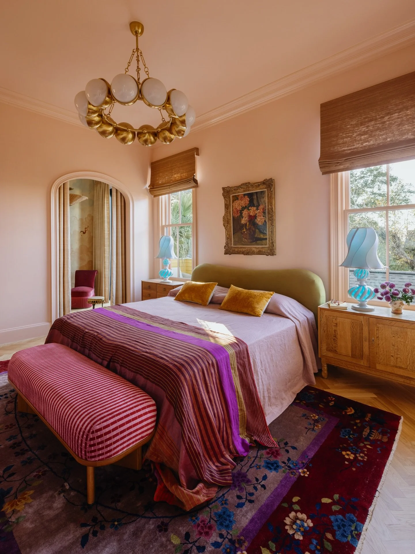 Welcome to our bedroom, a space that really came into its own at the very last minute. I love when that happens cause it forces you to make decisions. It&rsquo;s all about the eclectic mix here: an antique Art Deco rug grounds a reupholstered striped