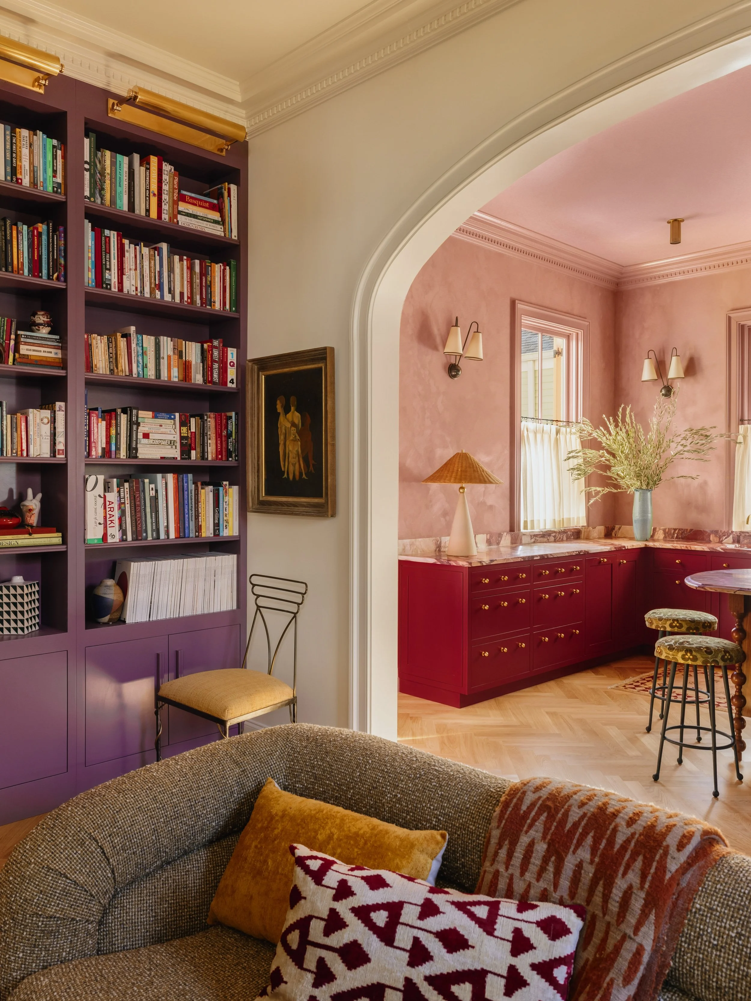 A peek from the living room into the kitchen. Instead of a completely open-concept layout, we used these squished elliptical arches to give each room its own identity, but kept the layout open enough for hosting and kitchen karaoke, obviously!
