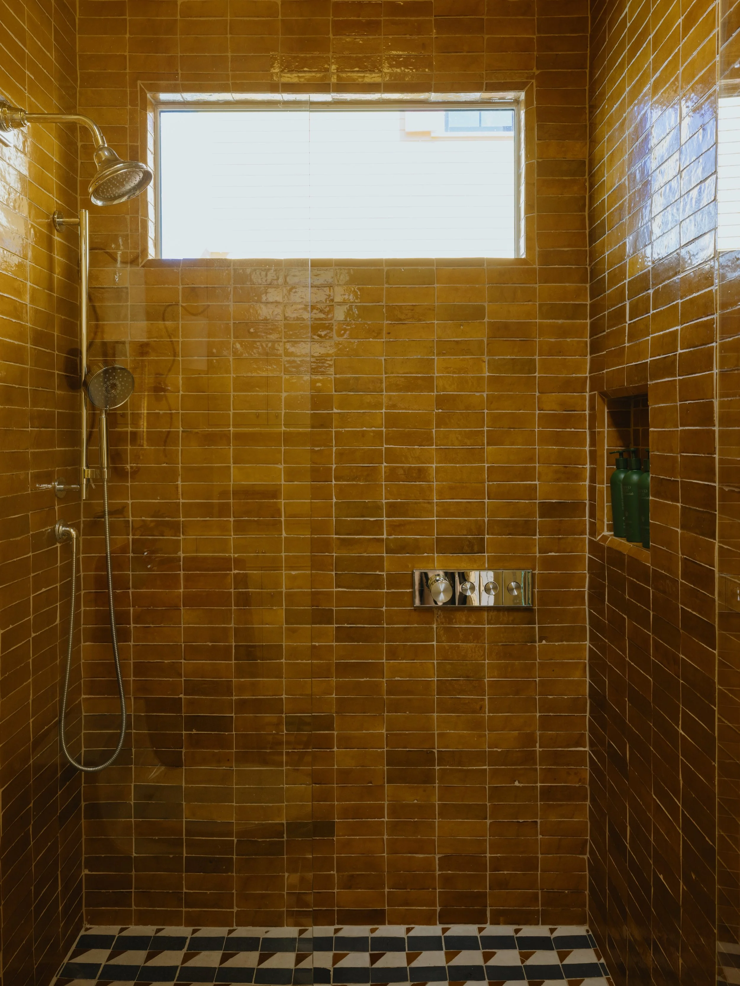 We went for Moroccan cottage vibes in the bathroom. We packed so much texture into this compact space with @zia_tile, from the mosaic zellige on the floor to the floor-to-ceiling tiles in the curbless shower. If you&rsquo;re looking to bring some per