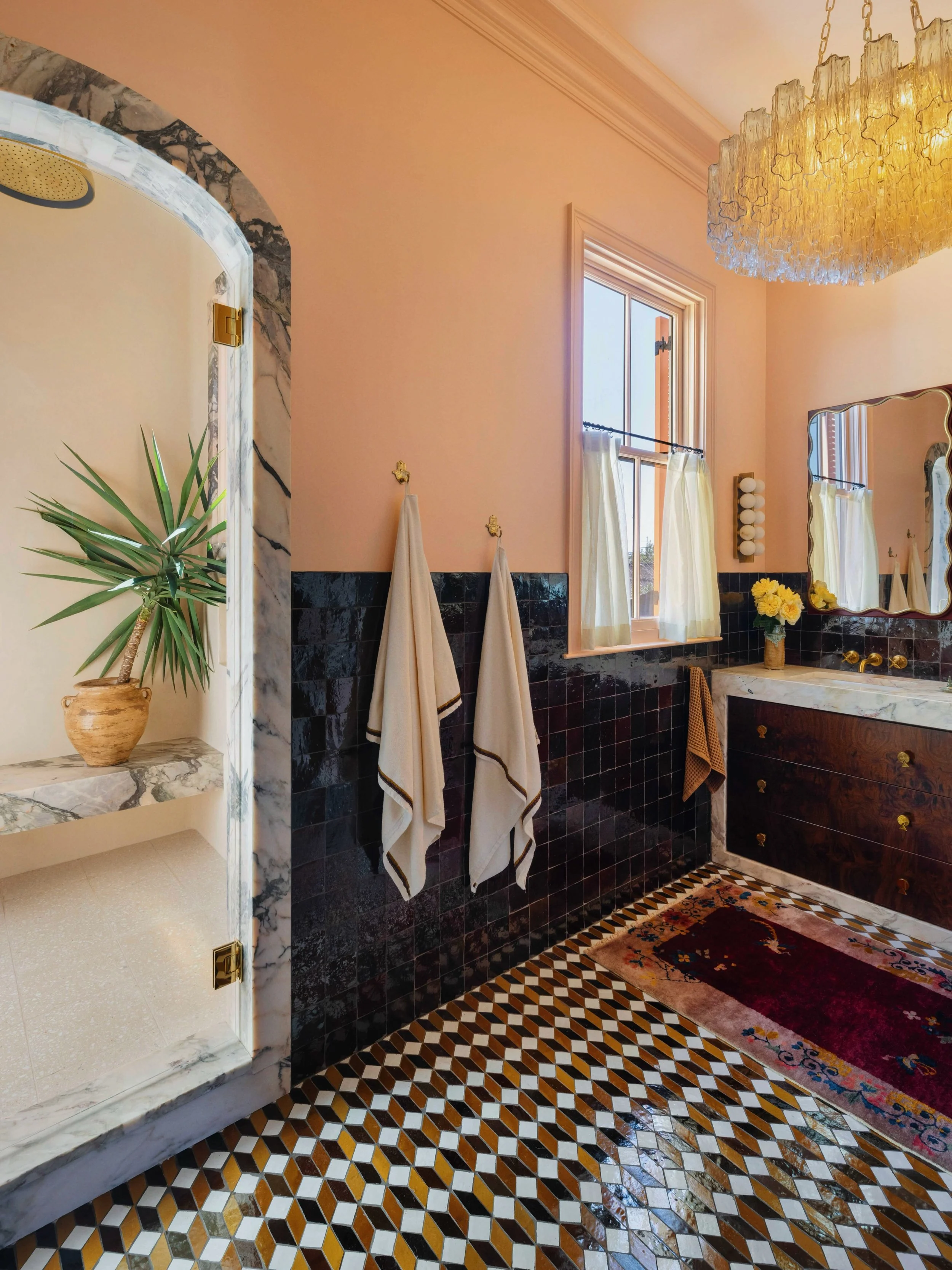 My obsession with @zia_tile&rsquo;s zellige continues. In the primary bath, we wrapped the walls halfway in burnt sugar. It&rsquo;s a rich, caramelly brown that shifts into a gorgeous burgundy depending on the time of day. I paired it with a mosaic t