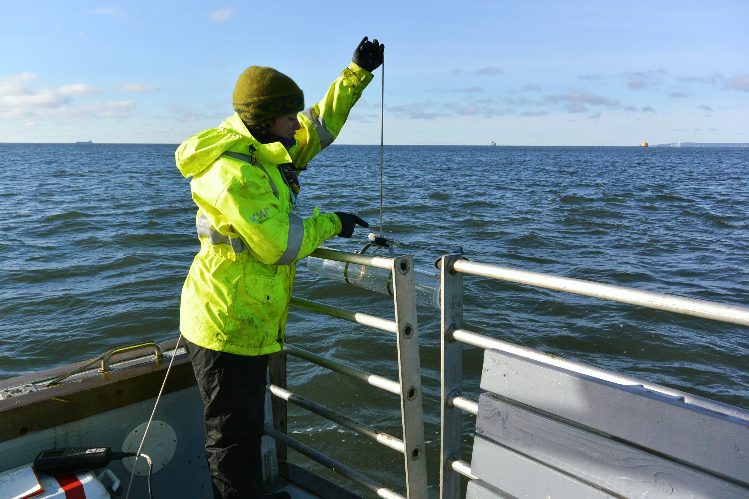 Lowering the Van Dorn water sampler into the water