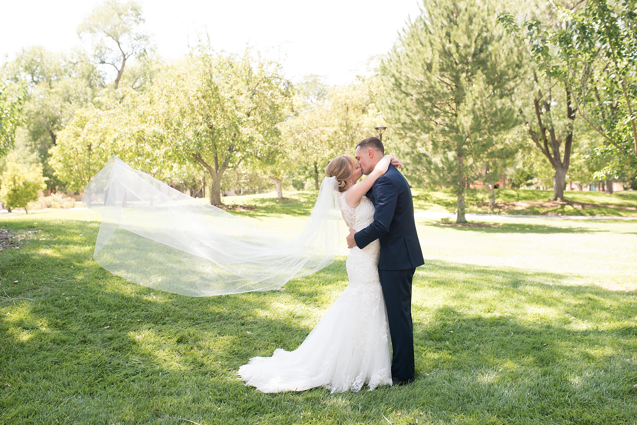 Wedding dress from Ann Matthews, jewelry by helzberg diamonds, suits by suits unlimited, hotel parque central wedding photographed by albuquerque wedding photographer kayla kitts photography