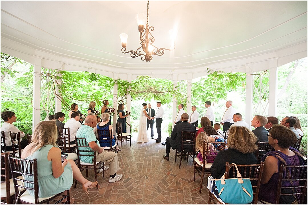 los-poblanos-wedding-ceremony-gazebo-greenery-burgundy-lace-elegant-summer-garden