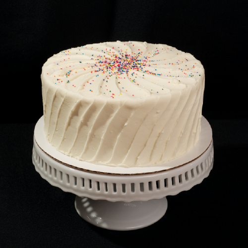 Vanilla Explosion Two layer vanilla cake with vanilla butter cream frosting. 6" (serves 8): $26 | 8" (serves 15): $38 | 10" (serves 25): $50 12" (serves 35): $74 | half-sheet (serves 55): $85 available year round