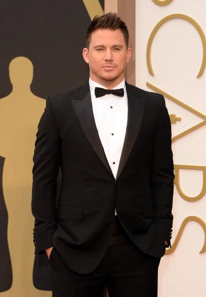 Channing Tatum wore a Gucci black peak lapel one button City tuxedo with a white evening shirt, black silk cummerbund, black silk bowtie and black leather laceups.