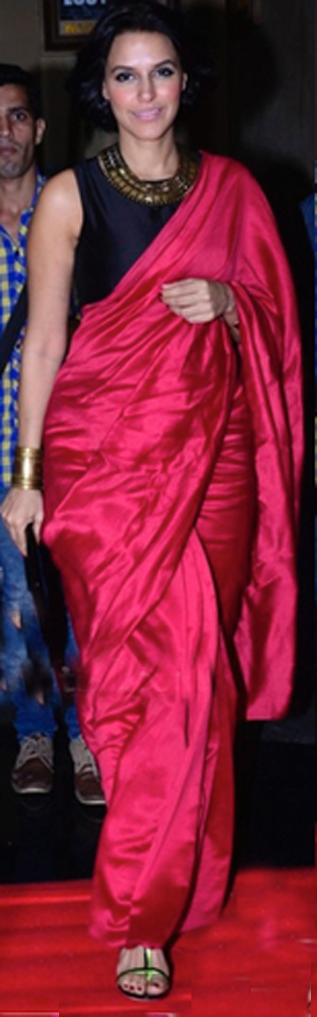 Neha Dhupia in a Payal Singhal saree, BCBG clutch and Jimmy Choo sandals. 