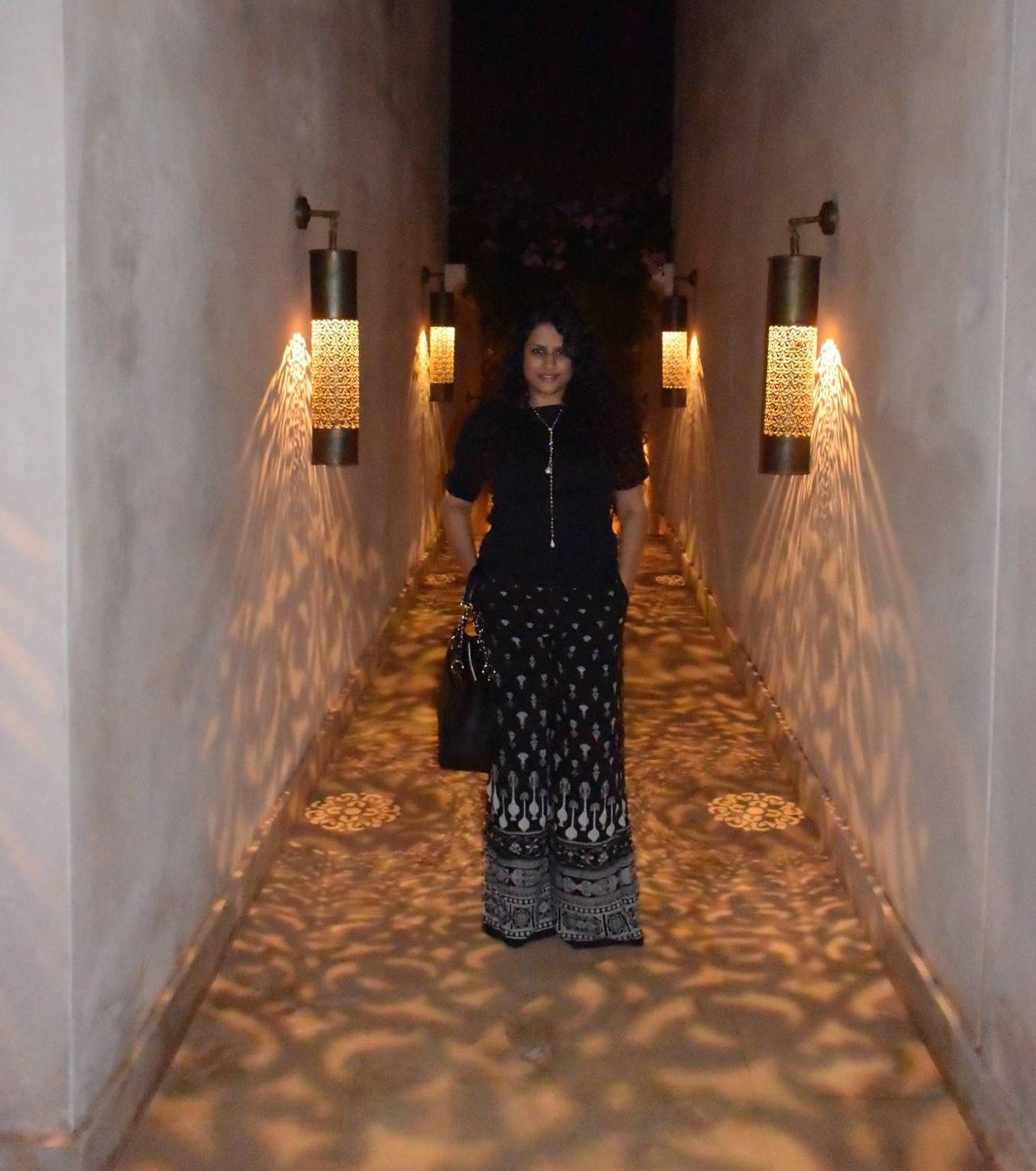 Pants: Tarun Tahiliani, Top: Ralph Lauren, Neckpiece & Ring: Isharya, Bag: Chanel