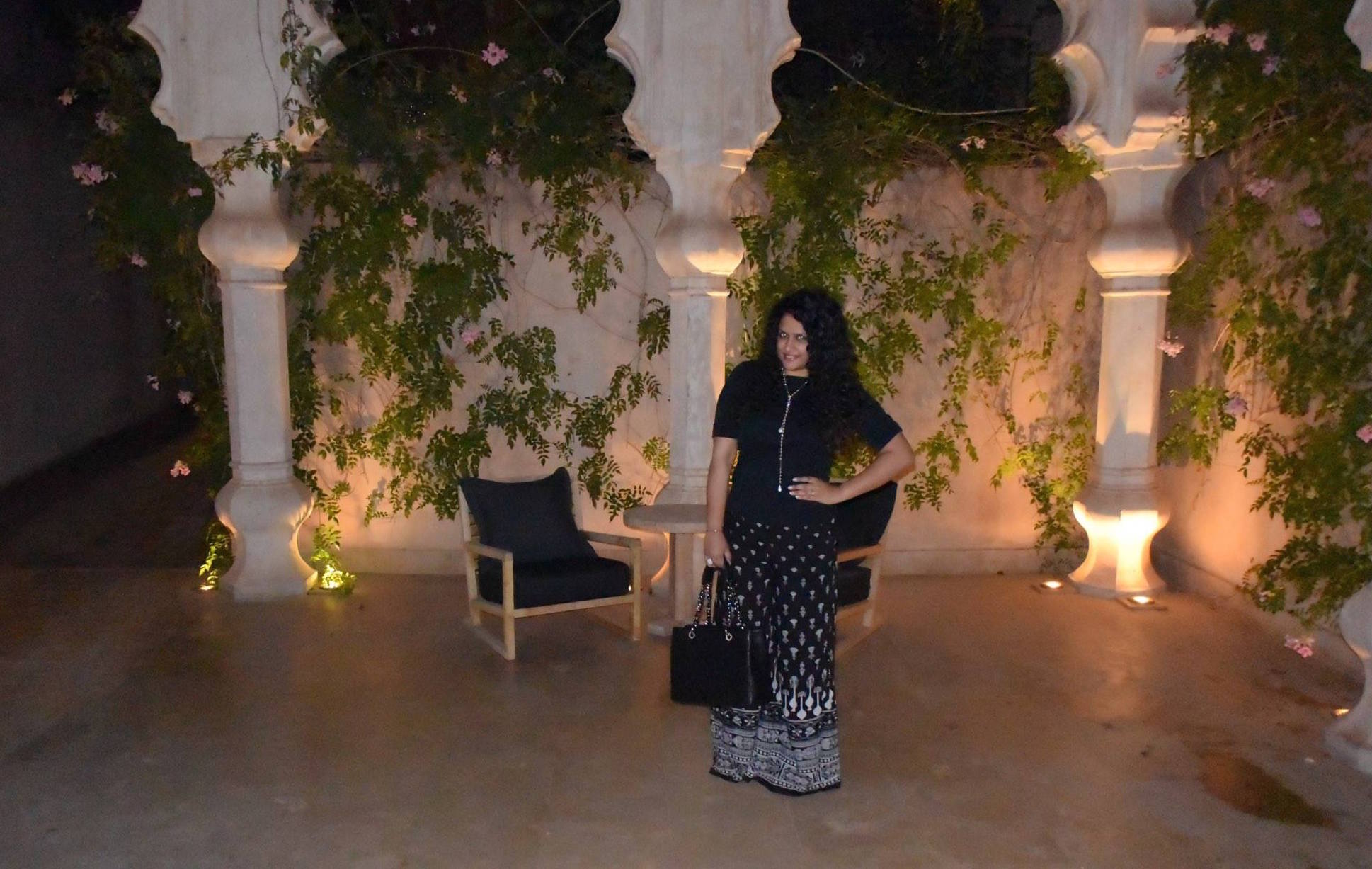 Pants: Tarun Tahiliani, Top: Ralph Lauren, Neckpiece & Ring: Isharya, Bag: Chanel