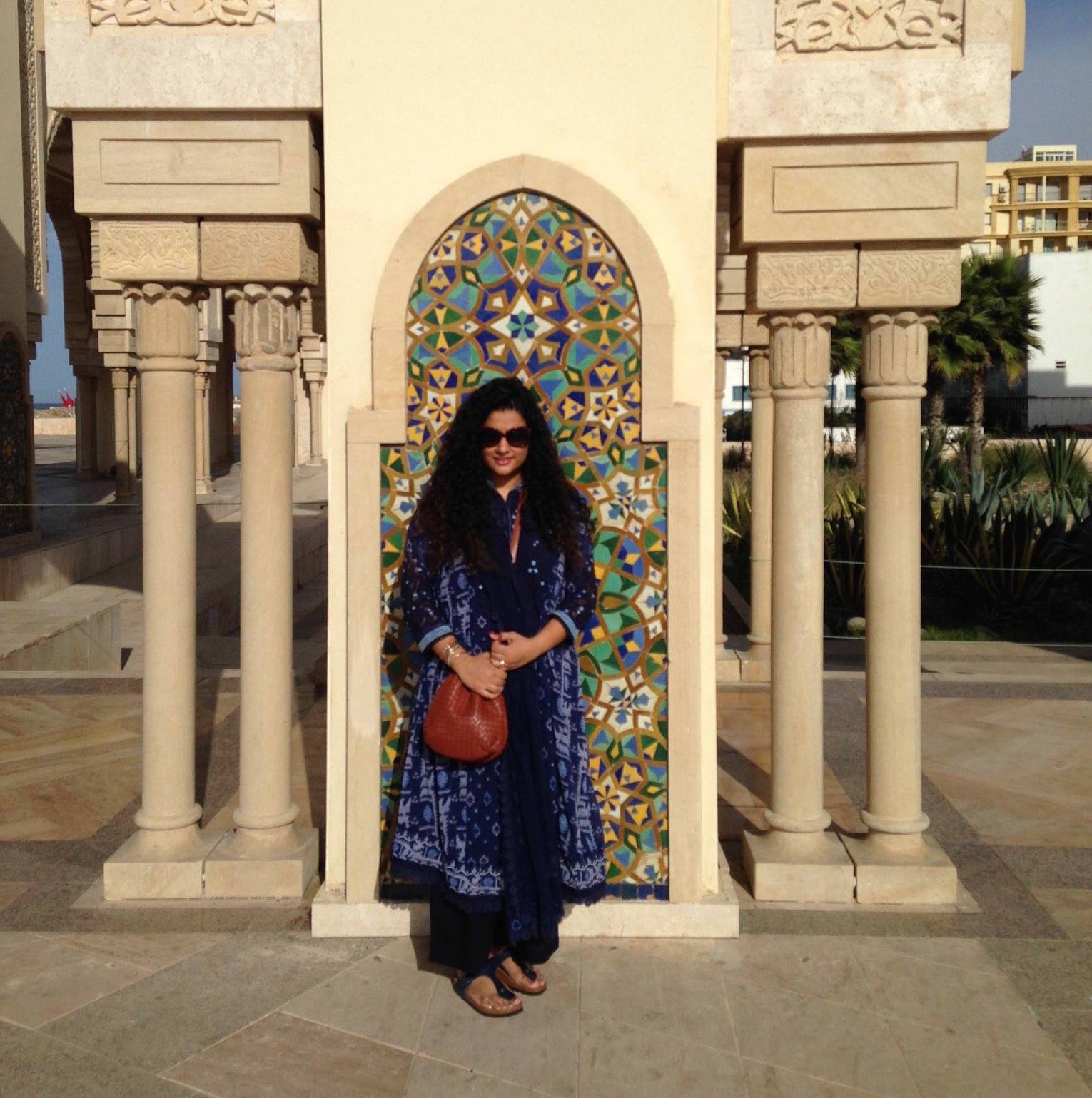 Hassan II Mosque in Casablanca Kurta, Pants & Stole - all part of a set: Label by Ritu Kumar, Sling: Bottega Veneta, Sunglasses: Dior: Bangles: Hermes, Sandals: Birkenstock, Ring Bulgari