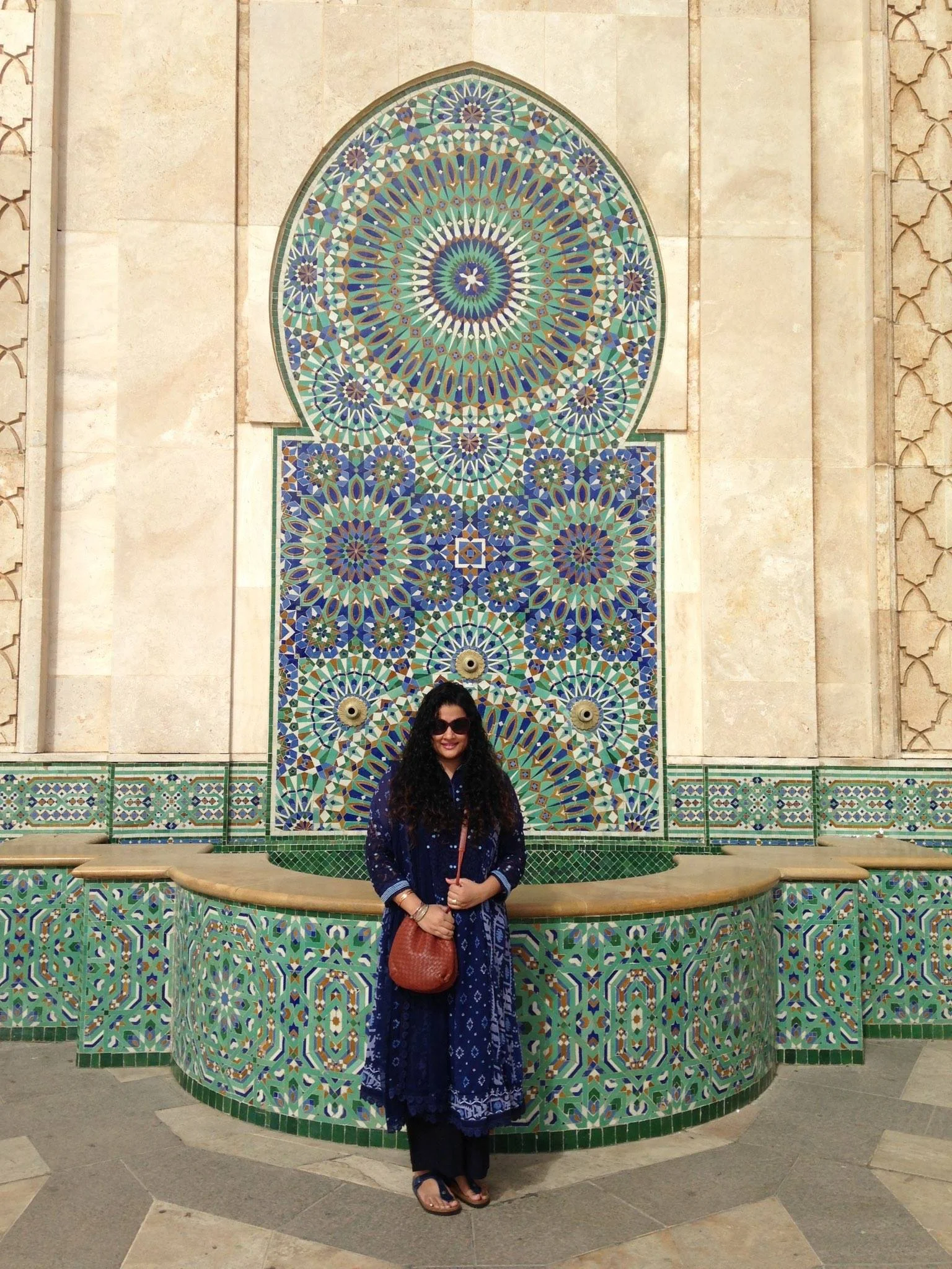 Hassan II Mosque in Casablanca Kurta, Pants & Stole - all part of a set: Label by Ritu Kumar, Sling: Bottega Veneta, Sunglasses: Dior: Bangles: Hermes, Sandals: Birkenstock, Ring Bulgari