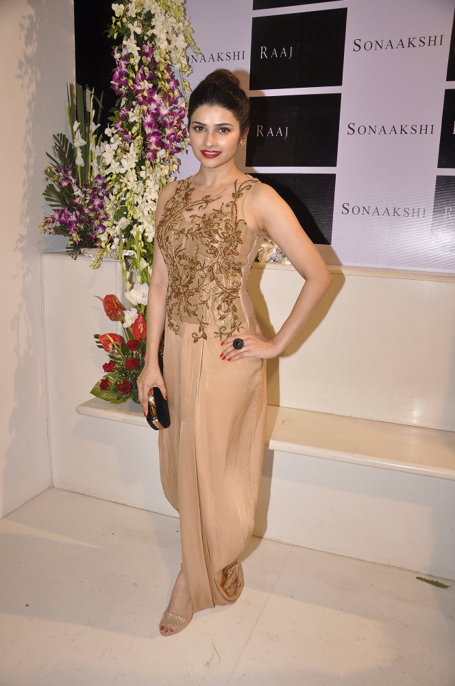 Prachi Desai was seen in an Antique Gold sheer back dhoti gown.