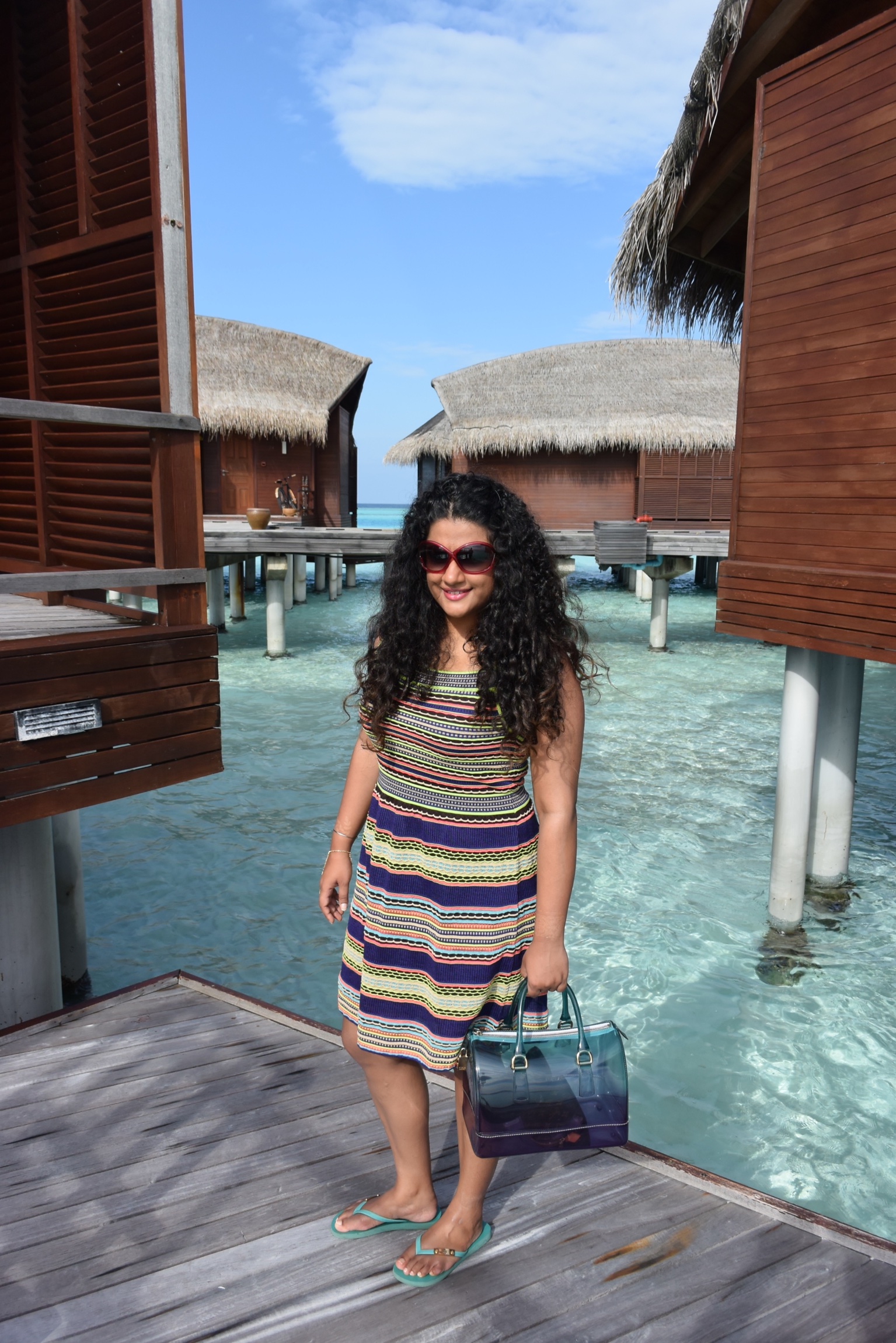 Dress M Missoni, Flip-Flop Tory Burch, Bag Furla, Sunglasses Tom Ford, Hand-harness Isharya