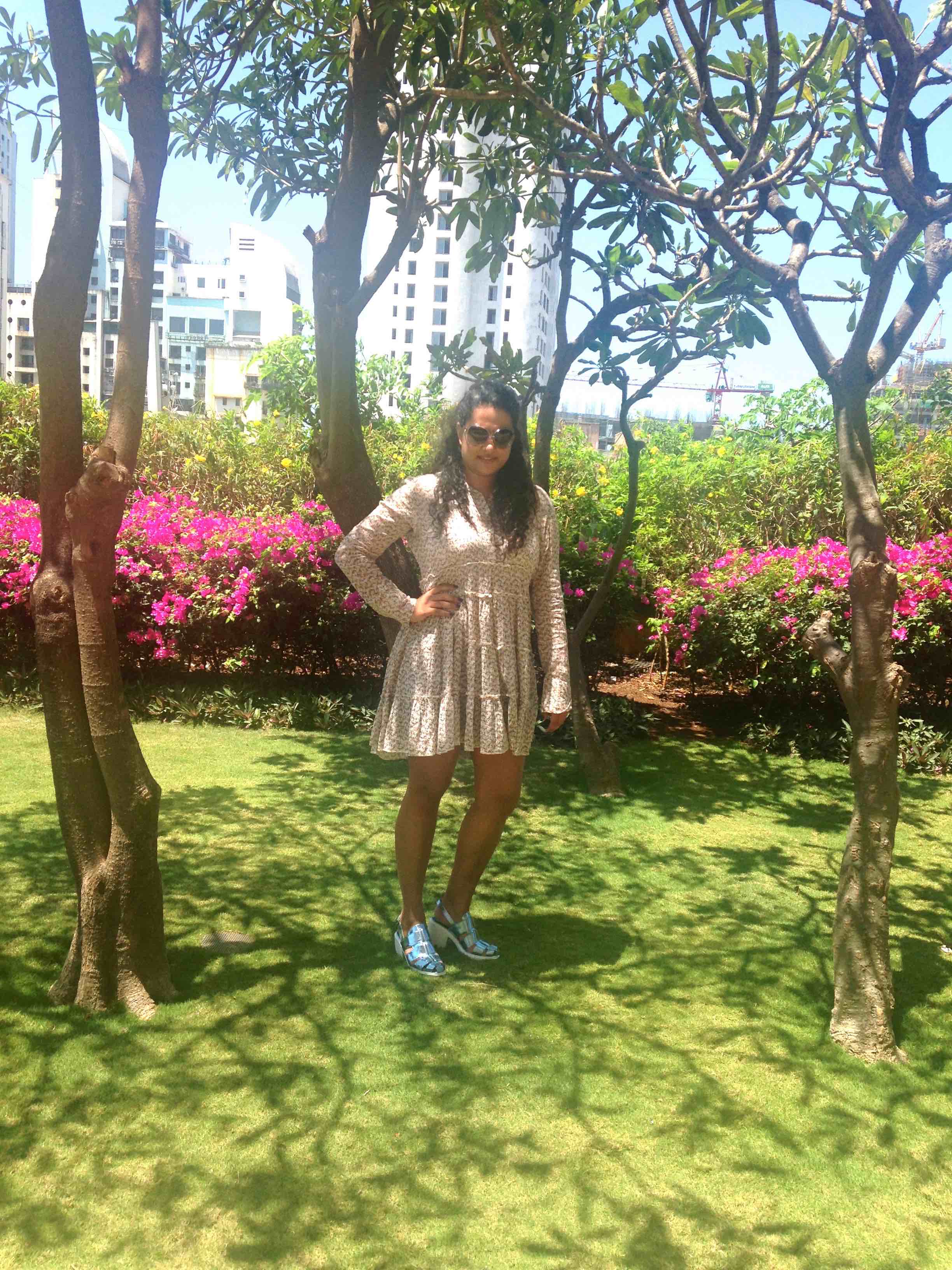 Sandals: Opening Ceremony, Tunic: Ralph Lauren, Sunglasses: Gucci, Shorts: Alice + Olivia