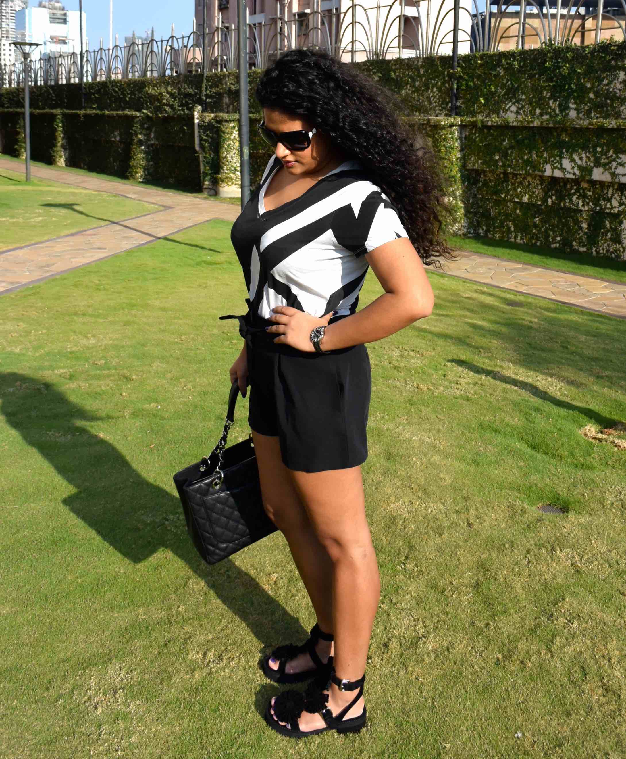 Shorts - Asos, T-shirt - Armani Exchange, Bag - Chanel, Sandals - Chloe for Opening Ceremony, Watch - Dior & Sunglasses - Chanel. 