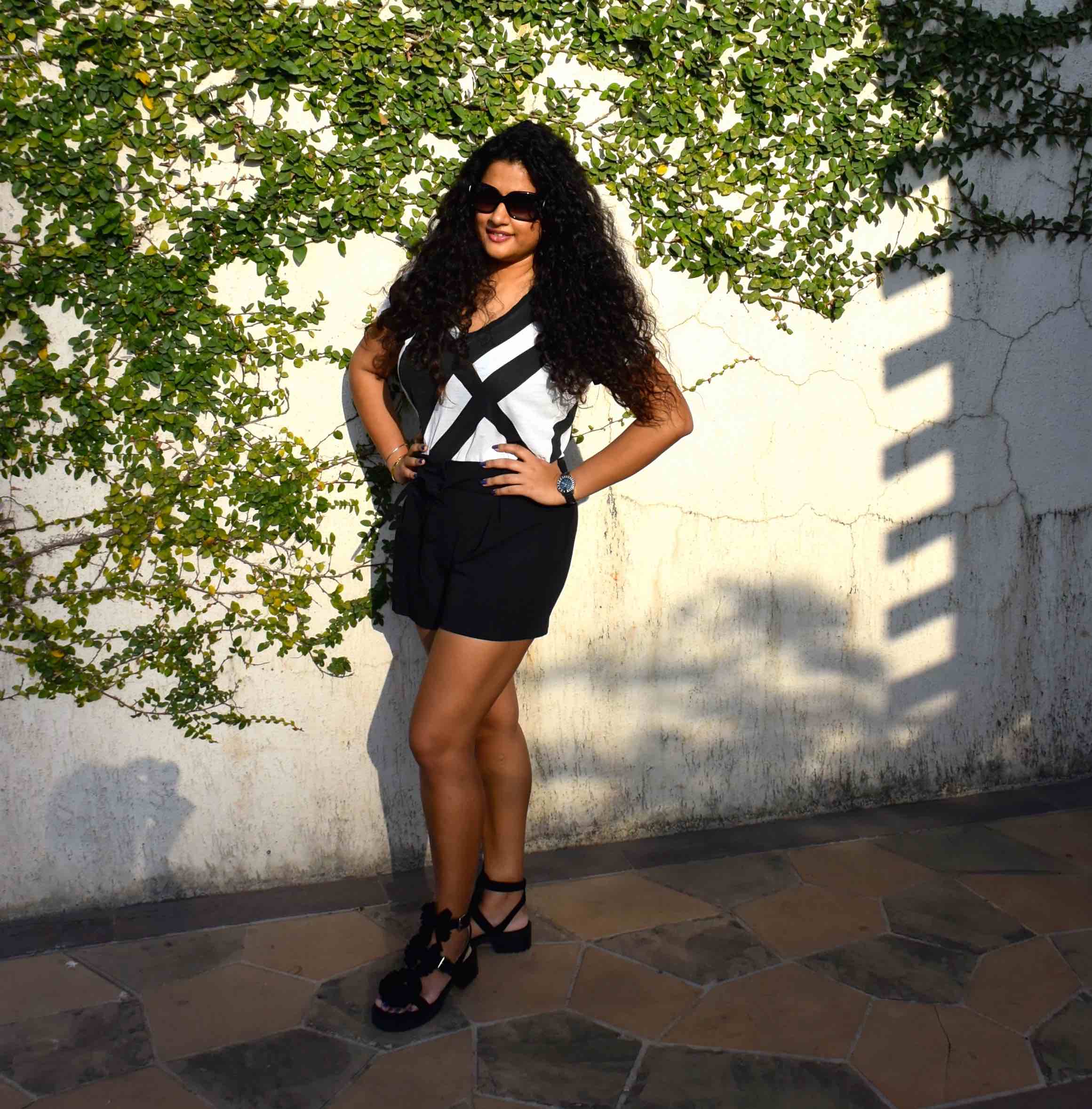 Shorts - Asos, T-shirt - Armani Exchange, Bag - Chanel, Sandals - Chloe for Opening Ceremony, Watch - Dior & Sunglasses - Chanel. 