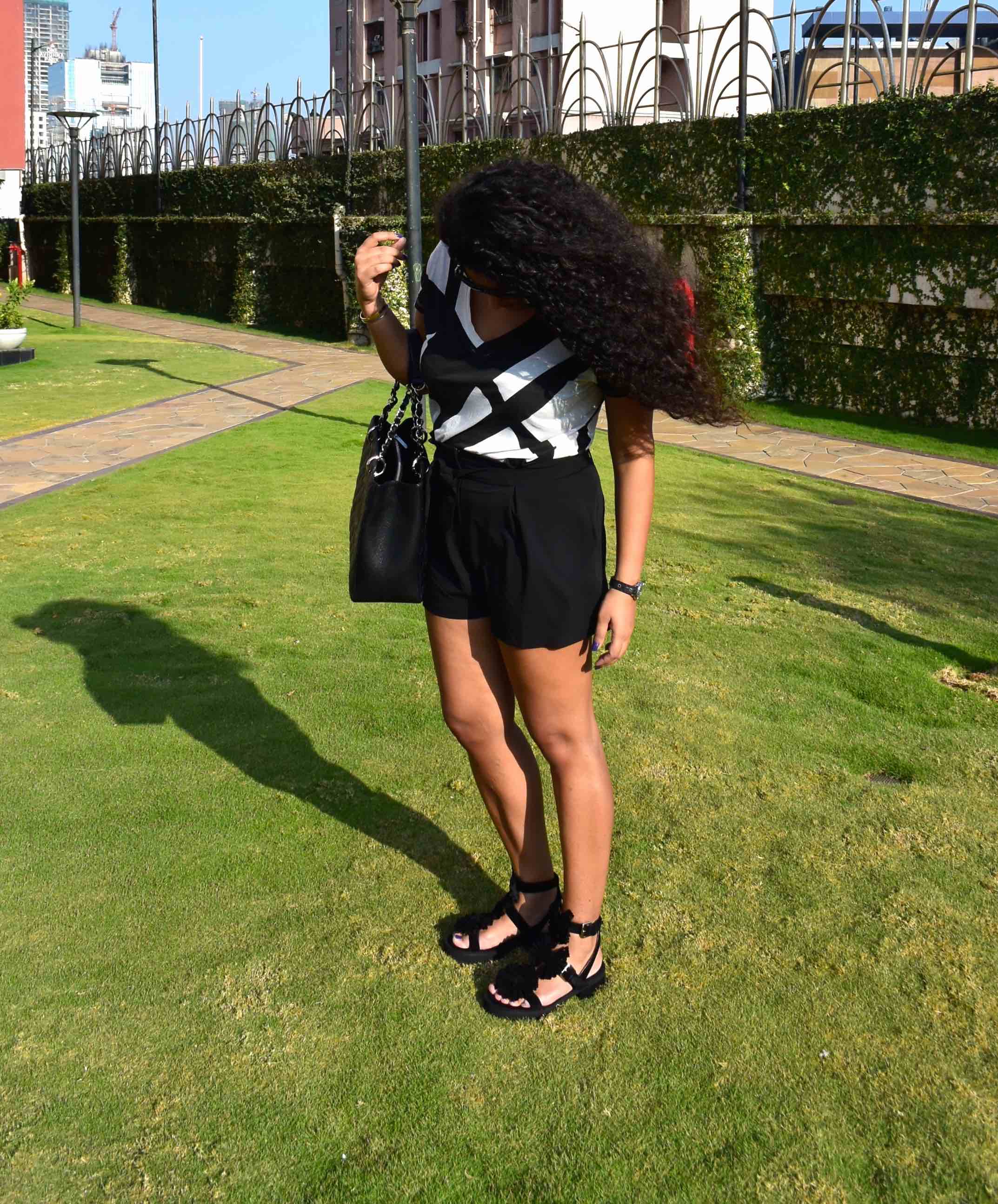 Shorts - Asos, T-shirt - Armani Exchange, Bag - Chanel, Sandals - Chloe for Opening Ceremony, Watch - Dior & Sunglasses - Chanel. 