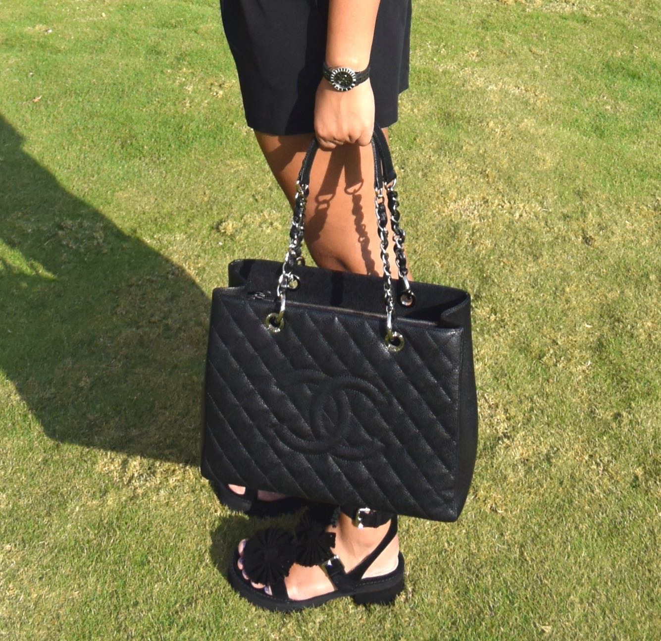 Shorts - Asos, T-shirt - Armani Exchange, Bag - Chanel, Sandals - Chloe for Opening Ceremony, Watch - Dior & Sunglasses - Chanel. 