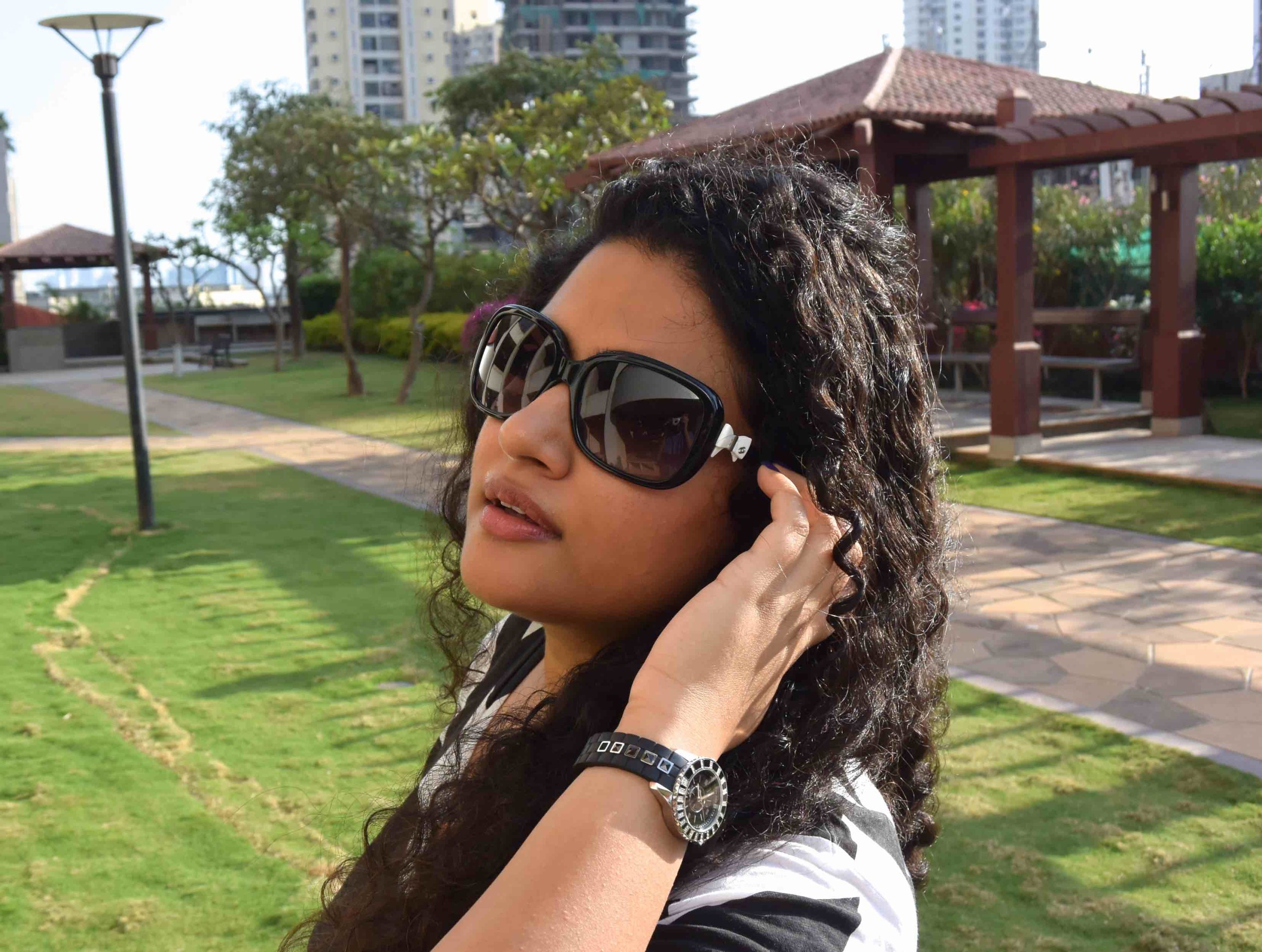 Shorts - Asos, T-shirt - Armani Exchange, Bag - Chanel, Sandals - Chloe for Opening Ceremony, Watch - Dior & Sunglasses - Chanel. 