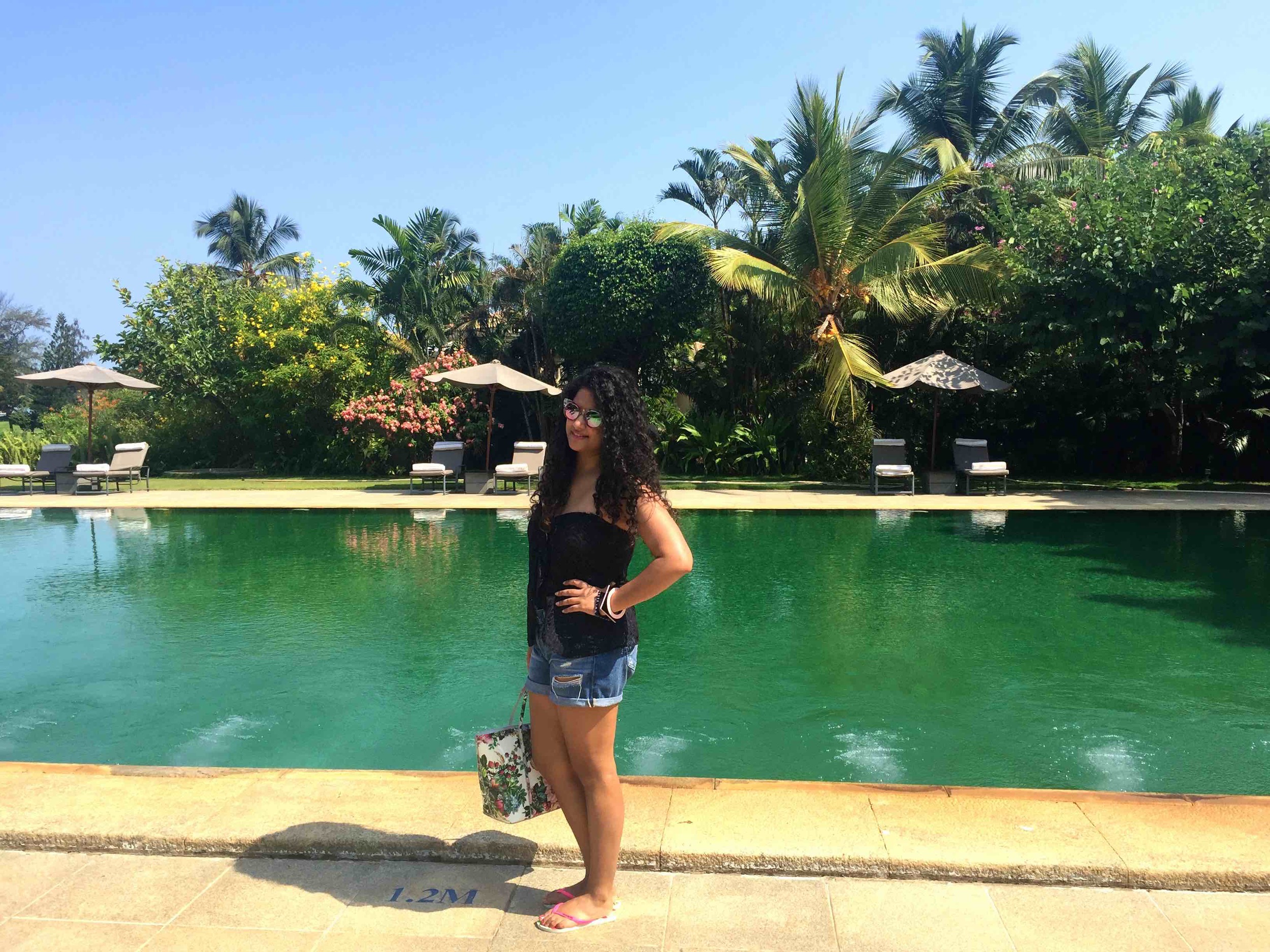 Bathing Suit: Ralph Lauren, Shorts: Adriano Goldschmied, Tote: Dolce & Gabbana, Flip-flips: Havaianas, Bangles: Furla, Sunglasses: Gucci