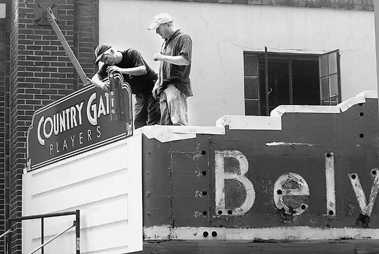 Alan Kull and Vic Kumma help install a new marquee in 2007.