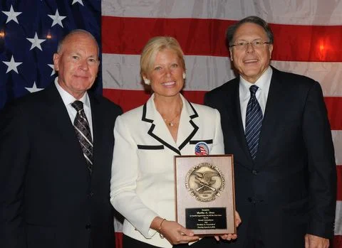 Martha Dean receiving the NRA's 2012 award in recognition of all she has done for freedom and the 2nd Amendment in Connecticut. (General Edward Milne (L),NRA's Wayne LaPierre (R))